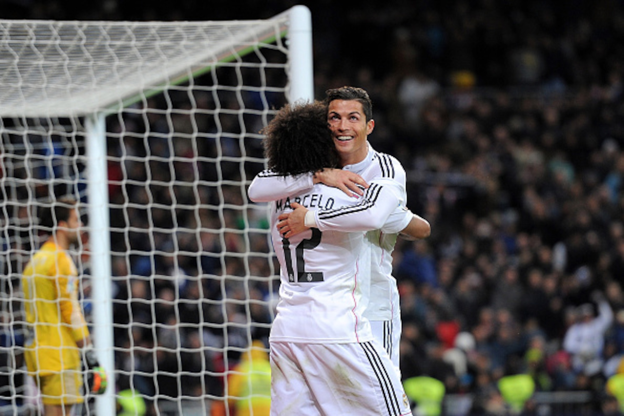 MADRID, SPAIN - DECEMBER 06:  Cristiano Ronaldo of Real Madrid celebrates with Marcelo after scoring Real's 3rd goal during the La Liga match between Real Madrid CF and Celta Vigo at Estadio Santiago Bernabeu on December 6, 2014 in Madrid, Spain.  (Photo 