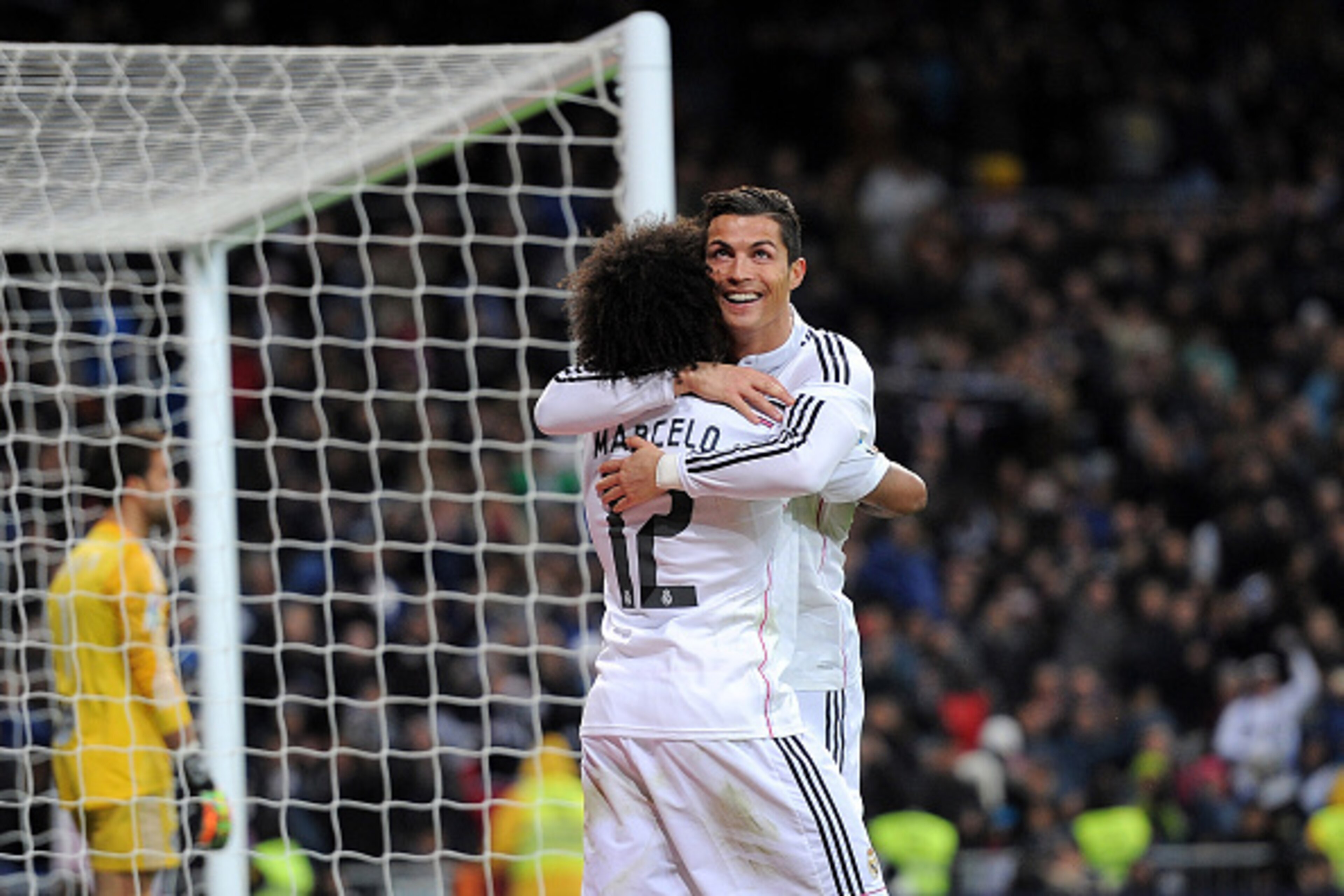 MADRID, SPAIN - DECEMBER 06:  Cristiano Ronaldo of Real Madrid celebrates with Marcelo after scoring Real's 3rd goal during the La Liga match between Real Madrid CF and Celta Vigo at Estadio Santiago Bernabeu on December 6, 2014 in Madrid, Spain.  (Photo 