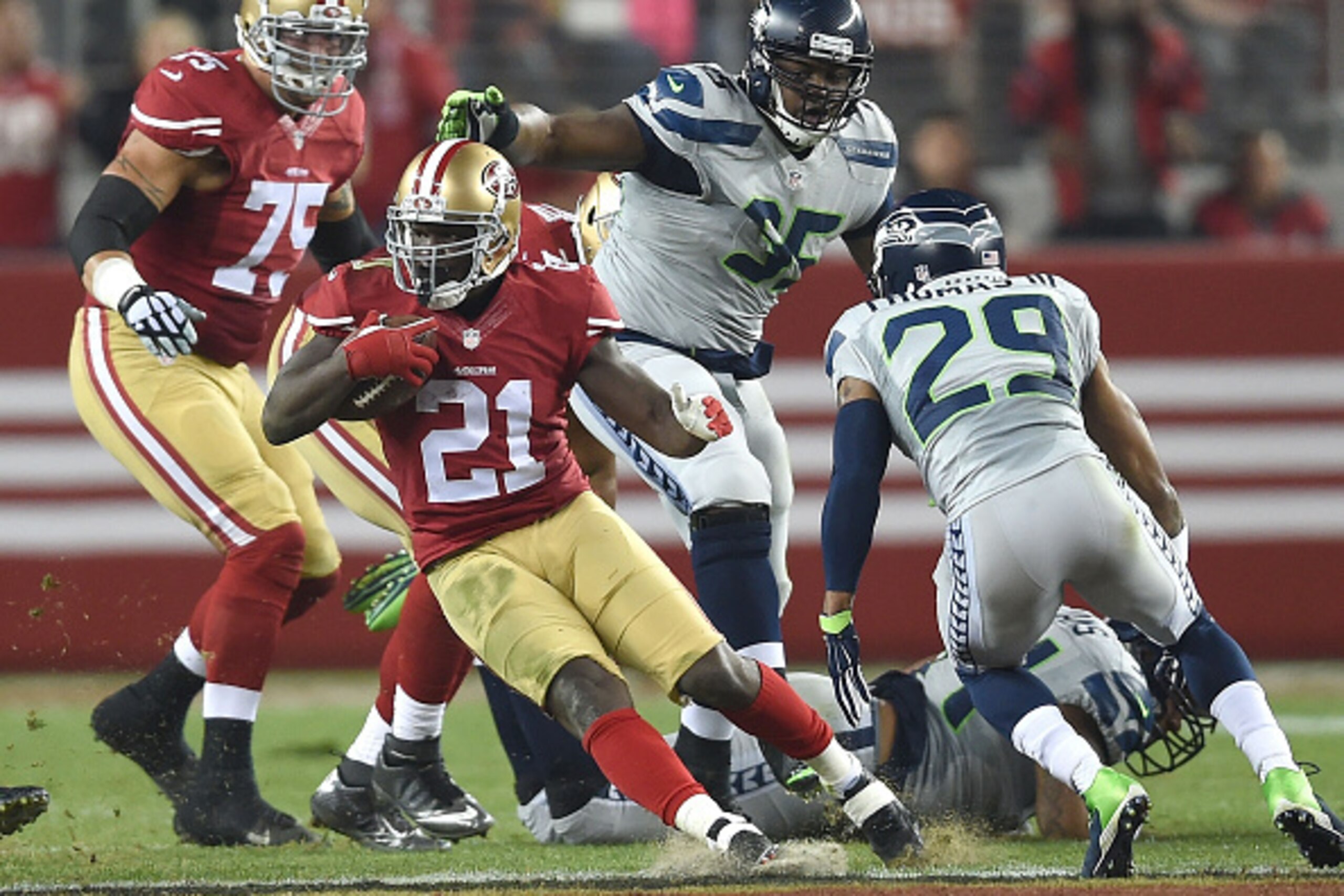 SANTA CLARA, CA - NOVEMBER 27: Frank Gore #21 of the San Francisco 49ers changes direction in the second quarter in front of Earl Thomas #29 of the Seattle Seahawks at Levi's Stadium on November 27, 2014 in Santa Clara, California. (Photo by Thearon W. SANTA CLARA, CA - NOVEMBER 27: Frank Gore #21 of the San Francisco 49ers changes direction in the second quarter in front of Earl Thomas #29 of the Seattle Seahawks at Levi's Stadium on November 27, 2014 in Santa Clara, California. (Photo by Thearon W.
