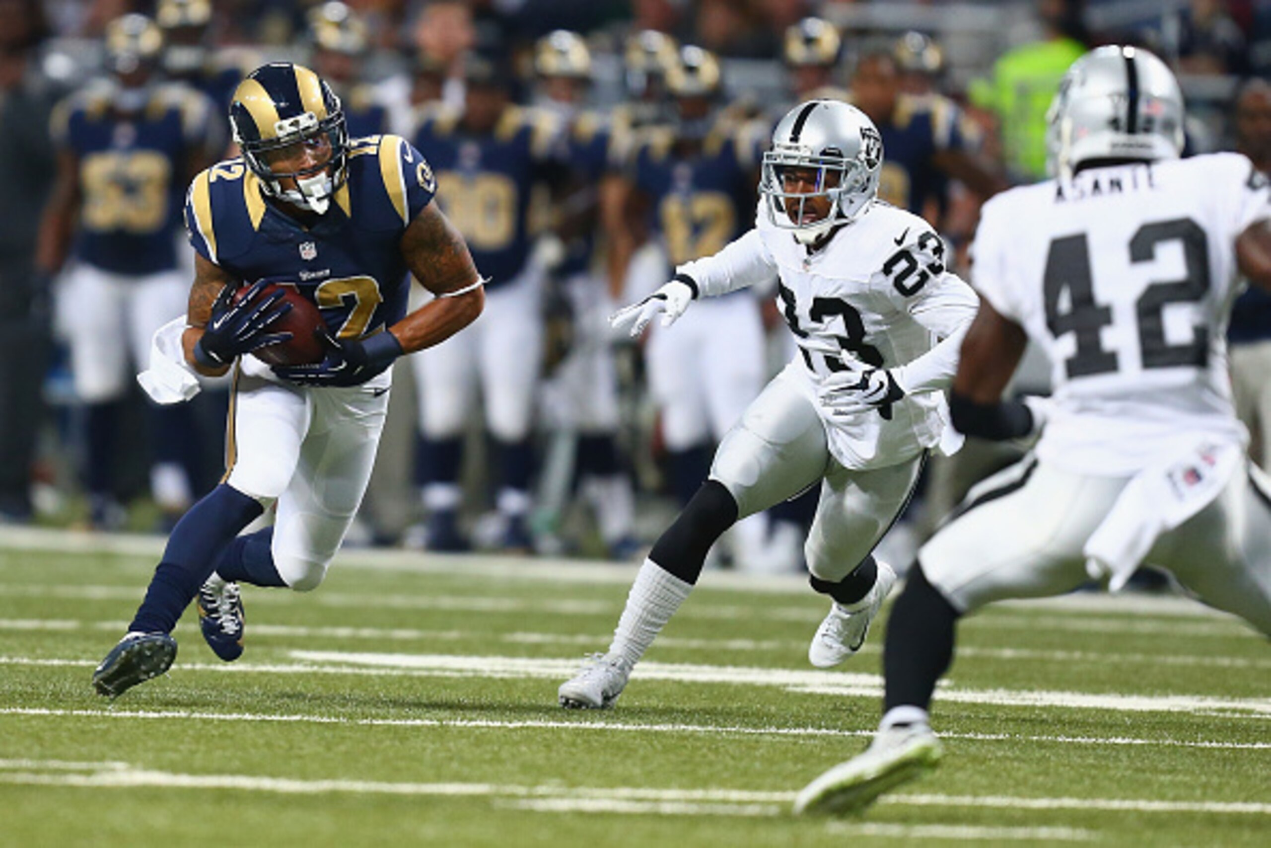 ST. LOUIS, MO - NOVEMBER 30: Stedman Bailey #12 of the St. Louis Rams looks to get past Tarell Brown #23 of the Oakland Raiders in the first quarter at the Edward Jones Dome on November 30, 2014 in St. Louis, Missouri.  The Rams beat the Raiders 52-0.  (P