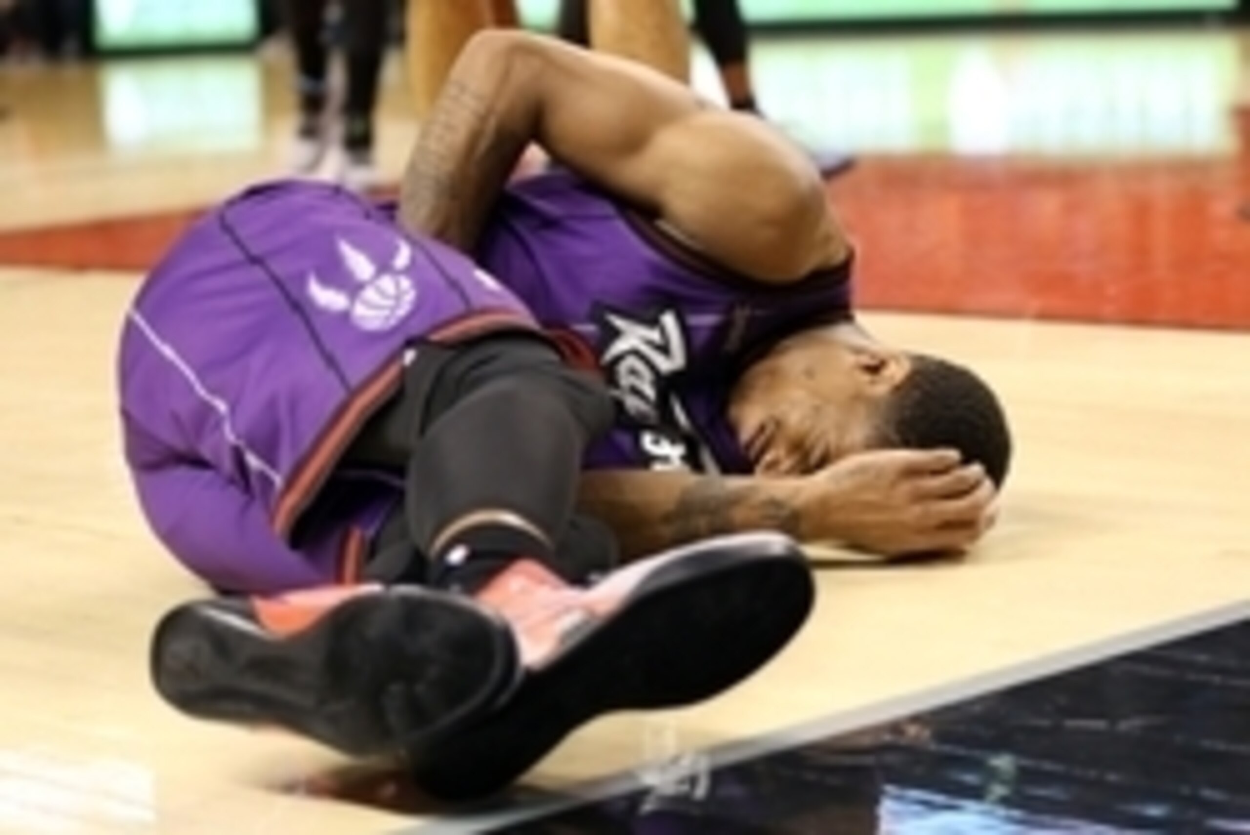 Nov 28, 2014; Toronto, Ontario, CAN; Toronto Raptors guard DeMar DeRozan (10) reacts after going down with a leg injury against the Dallas Mavericks at Air Canada Centre. The Mavericks beat the Raptors 106-102. Mandatory Credit: Tom Szczerbowski-USA TODAY