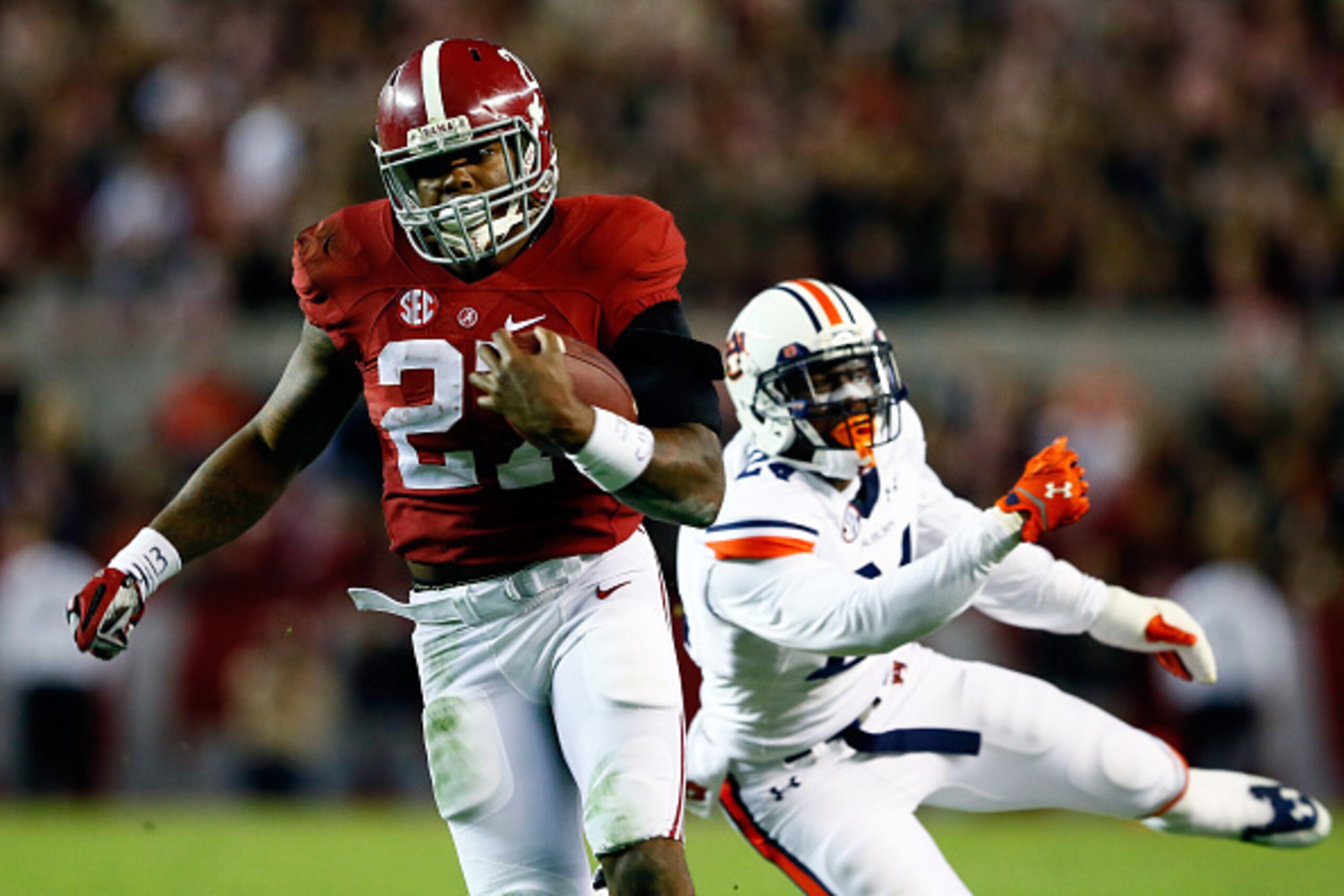 TUSCALOOSA, AL - NOVEMBER 29:  Derrick Henry #27 of the Alabama Crimson Tide runs the ball in the fourth quarter against the Auburn Tigers during the Iron Bowl at Bryant-Denny Stadium on November 29, 2014 in Tuscaloosa, Alabama.  (Photo by Kevin C. Cox/Ge