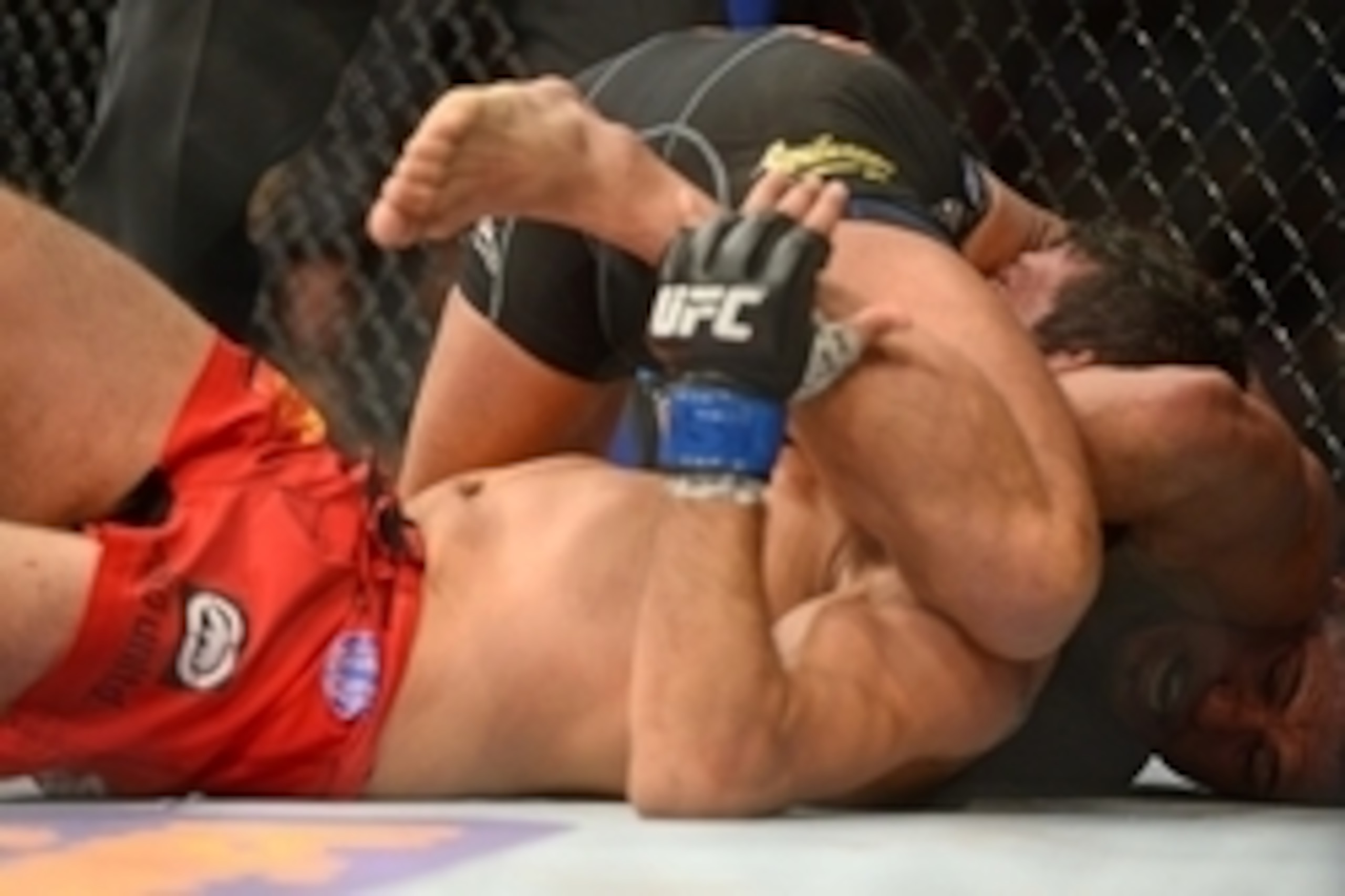 Dec 6, 2014; Las Vegas, NV, USA; Anthony Pettis (red) submits Gilbert Melendez (blue) during UFC 181 at Madalay Bay Events Center. Pettis won via second round submission. Mandatory Credit: Joe Camporeale-USA TODAY Sports