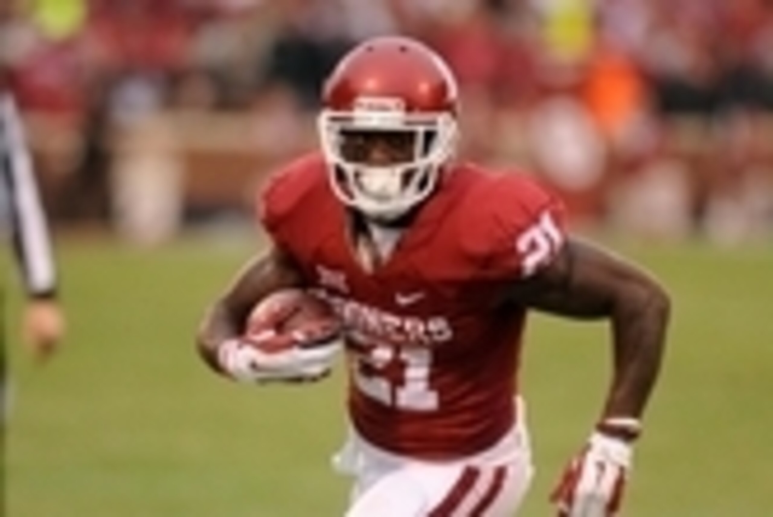 Dec 6, 2014; Norman, OK, USA; Oklahoma Sooners running back Keith Ford (21) runs after a catch against the Oklahoma State Cowboys during the second quarter at Gaylord Family - Oklahoma Memorial Stadium. Mandatory Credit: Mark D. Smith-USA TODAY Sports Dec 6, 2014; Norman, OK, USA; Oklahoma Sooners running back Keith Ford (21) runs after a catch against the Oklahoma State Cowboys during the second quarter at Gaylord Family - Oklahoma Memorial Stadium. Mandatory Credit: Mark D. Smith-USA TODAY Sports