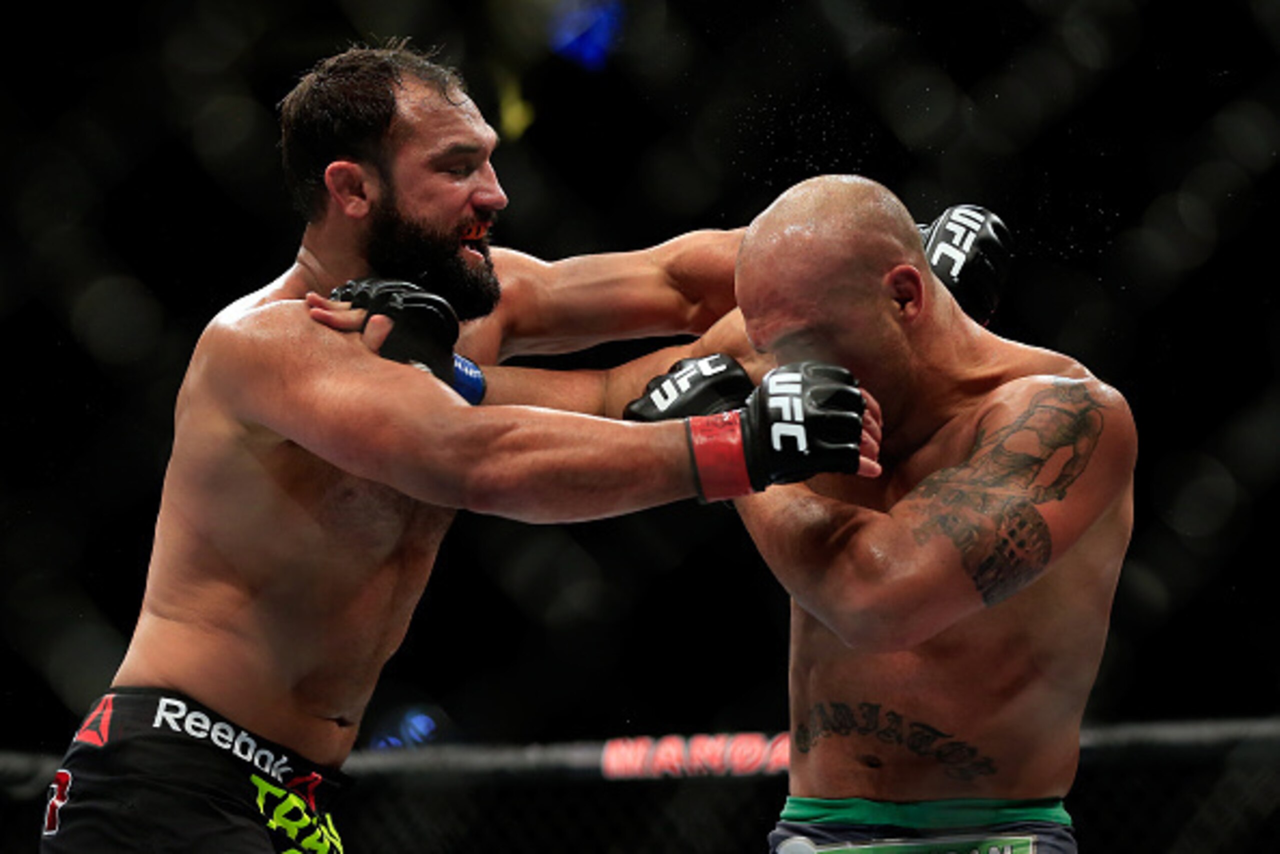 LAS VEGAS, NV - DECEMBER 06:  Robbie Lawler punches Johny Hendricks in their welterweight title fight during the UFC 181 event at the Mandalay Bay Events Center on December 6, 2014 in Las Vegas, Nevada.  (Photo by Alex Trautwig/Getty Images)