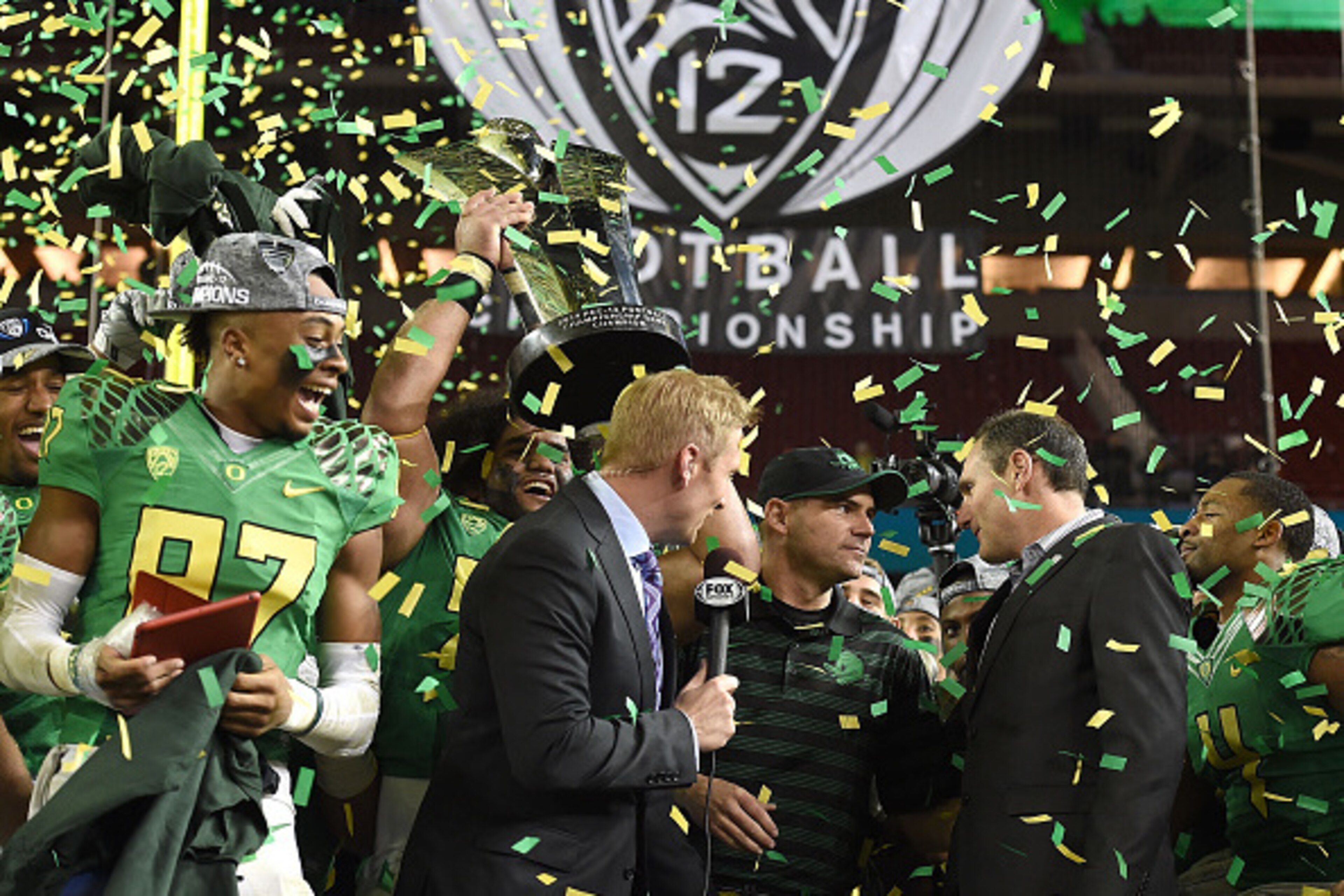 SANTA CLARA, CA - DECEMBER 05:  Head coach of the Oregon Ducks Mark Helfrich celebrates his team's victory against the Arizona Wildcats during the PAC-12 Championships at Levi's Stadium on December 5, 2014 in Santa Clara, California.  (Photo by Thearon W.