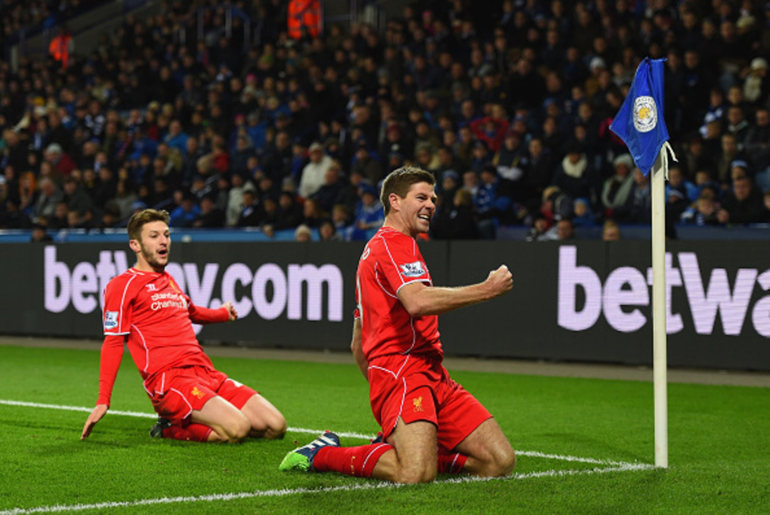 LEICESTER, ENGLAND - DECEMBER 02:  Steven Gerrard of Liverpool celebrates with teammate Adam Lallana of Liverpool after scoring his team's second goal during the Barclays Premier League match between Leicester City and Liverpool at The King Power Stadium 