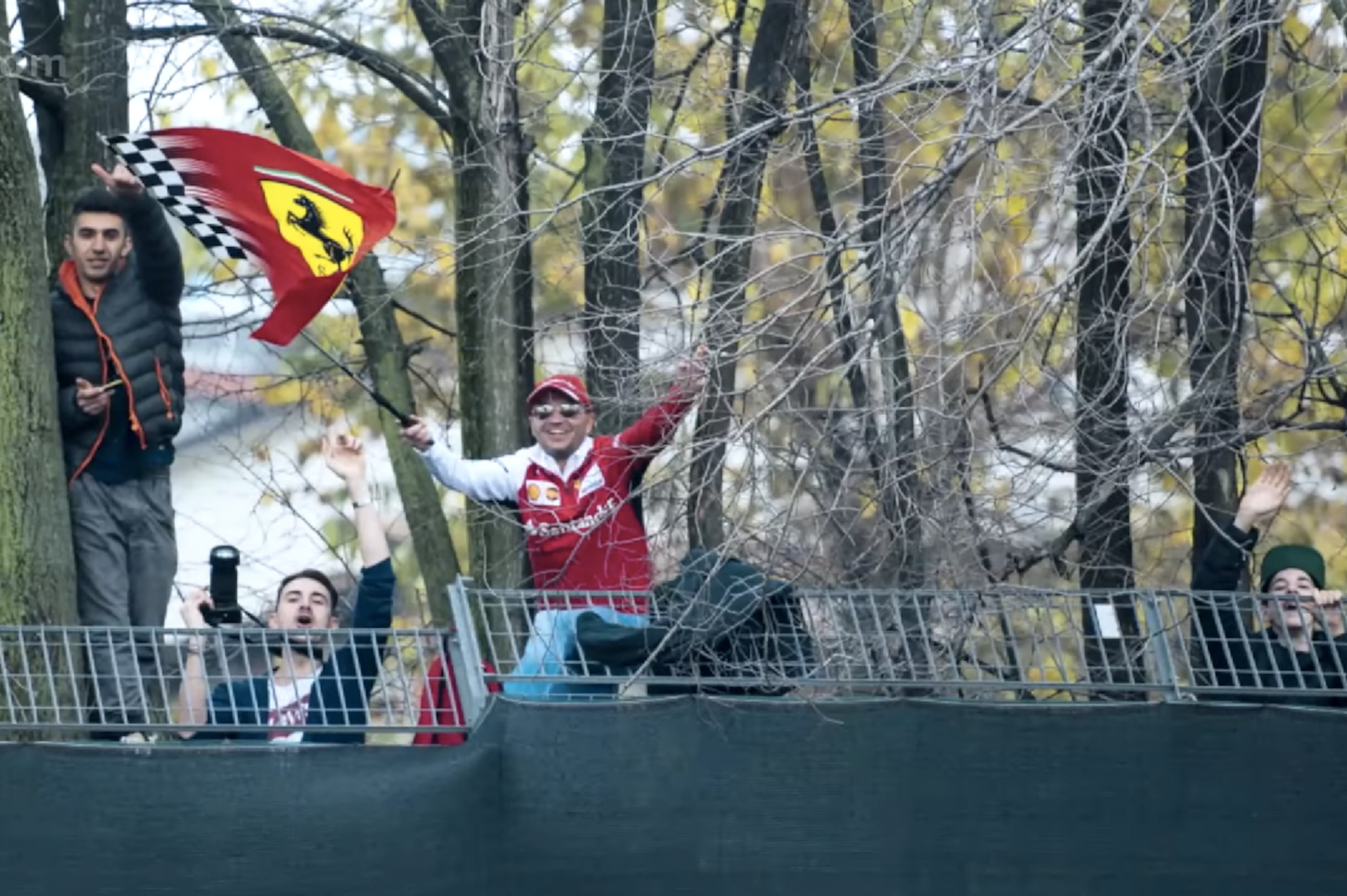 Tifosi climbing the fence at Fiorano to see Vettel's first Ferrari test.
