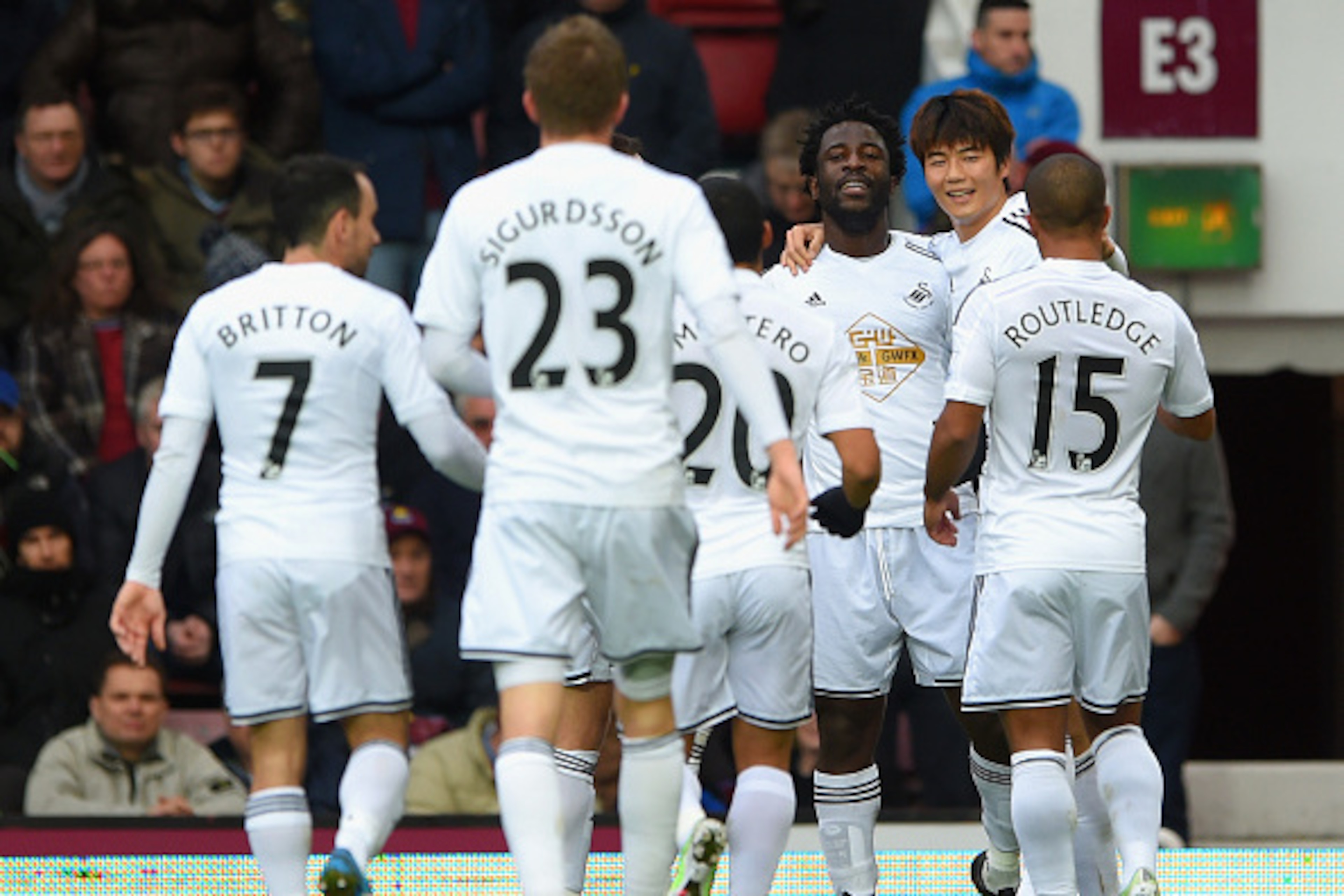 LONDON, ENGLAND - DECEMBER 07:  Wilfried Bony of Swansea City celebrates with team mates after scoring the opening goal during the Barclays Premier League match between West Ham United and Swansea City at Boleyn Ground on December 7, 2014 in London, Engla