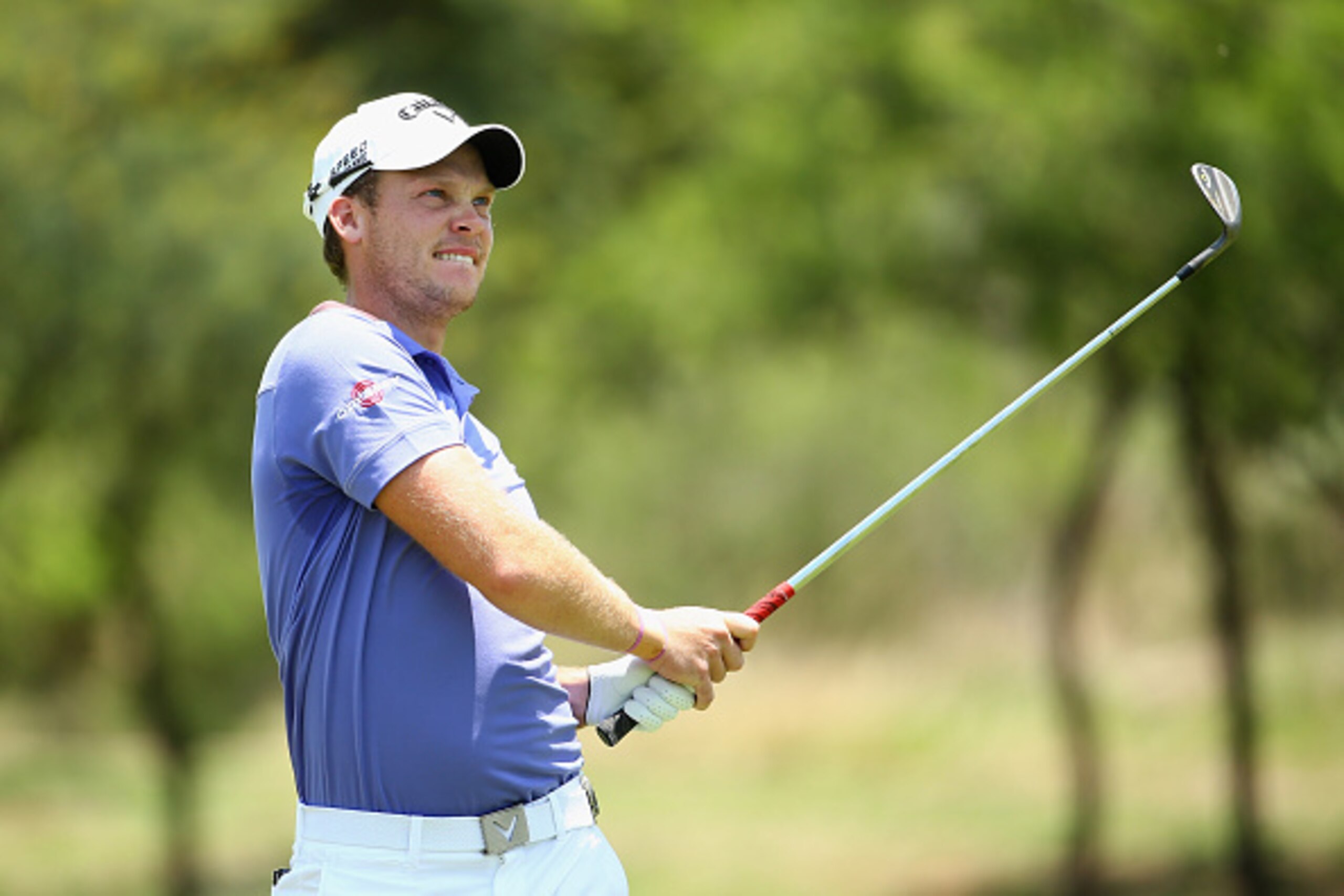 SUN CITY, SOUTH AFRICA - DECEMBER 07:  Danny Willett of England plays into the 1st green during the final round of the Nedbank Golf Challenge at the Gary Player Country Club on December 7, 2014 in Sun City, South Africa.  (Photo by Richard Heathcote/Getty