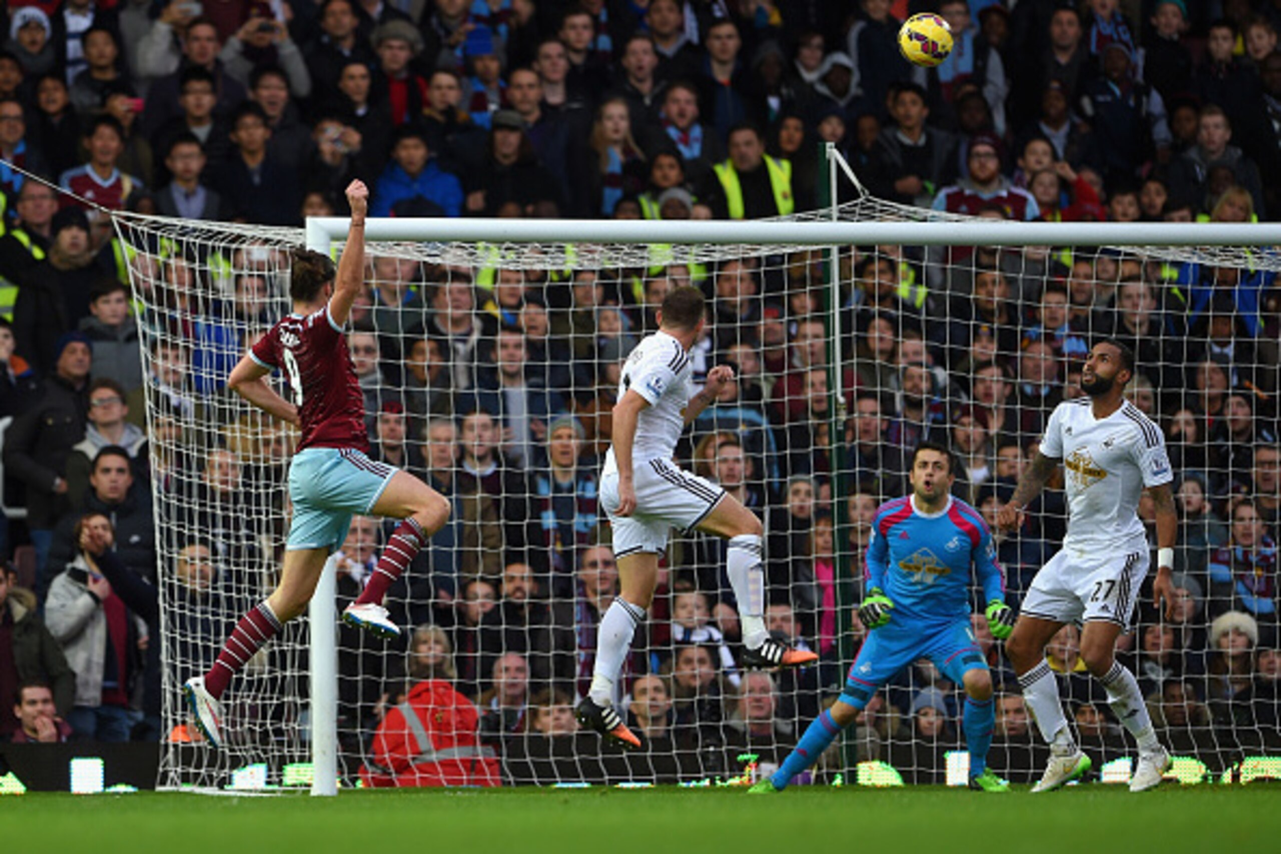 LONDON, ENGLAND - DECEMBER 07: Andy Carroll of West Ham heads in their first goal during the Barclays Premier League match between West Ham United and Swansea City at Boleyn Ground on December 7, 2014 in London, England. (Photo by Michael Regan/Getty Im LONDON, ENGLAND - DECEMBER 07: Andy Carroll of West Ham heads in their first goal during the Barclays Premier League match between West Ham United and Swansea City at Boleyn Ground on December 7, 2014 in London, England. (Photo by Michael Regan/Getty Im