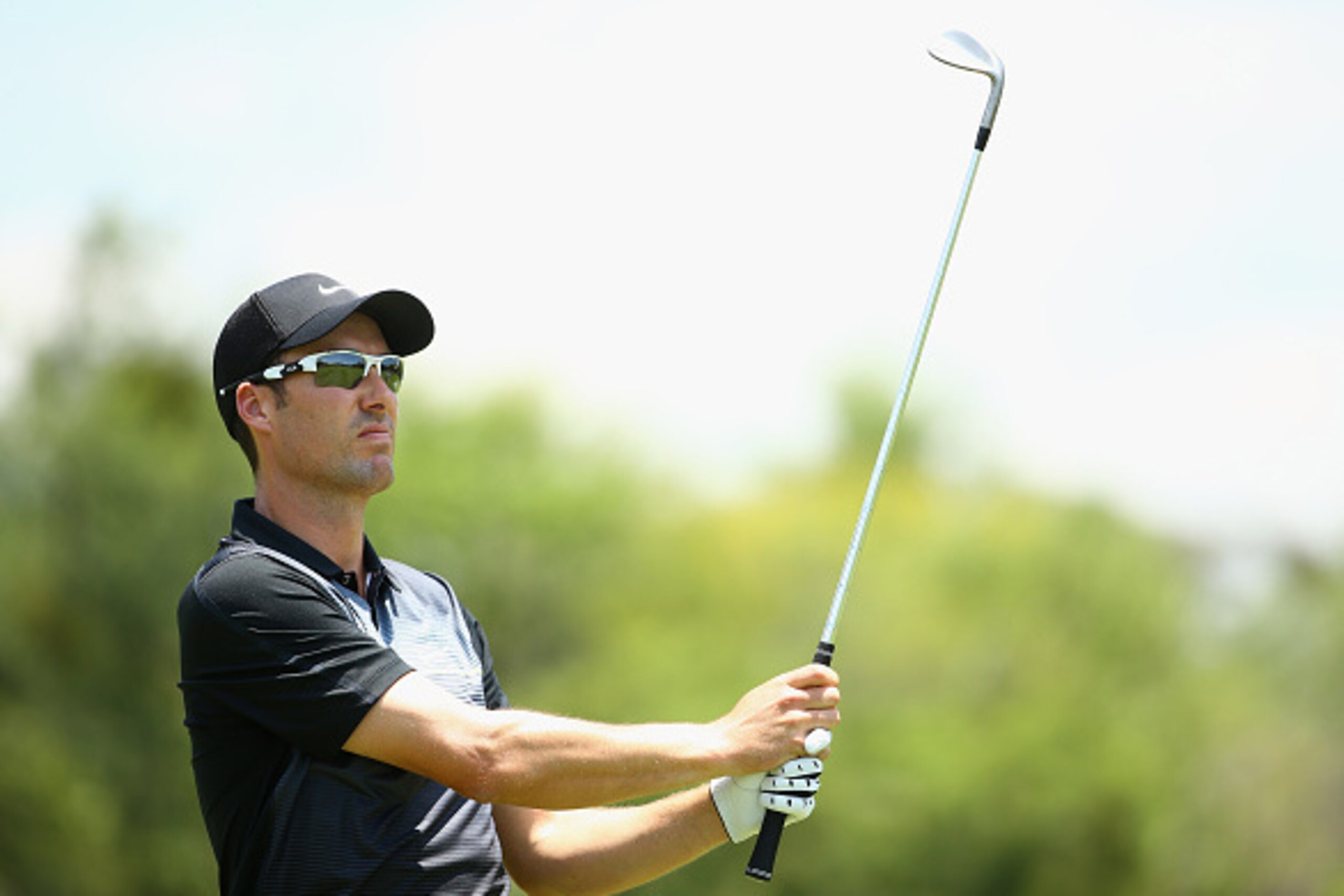 SUN CITY, SOUTH AFRICA - DECEMBER 07:  Ross Fisher of England plays into the 1st green during the final round of the Nedbank Golf Challenge at the Gary Player Country Club on December 7, 2014 in Sun City, South Africa.  (Photo by Richard Heathcote/Getty I