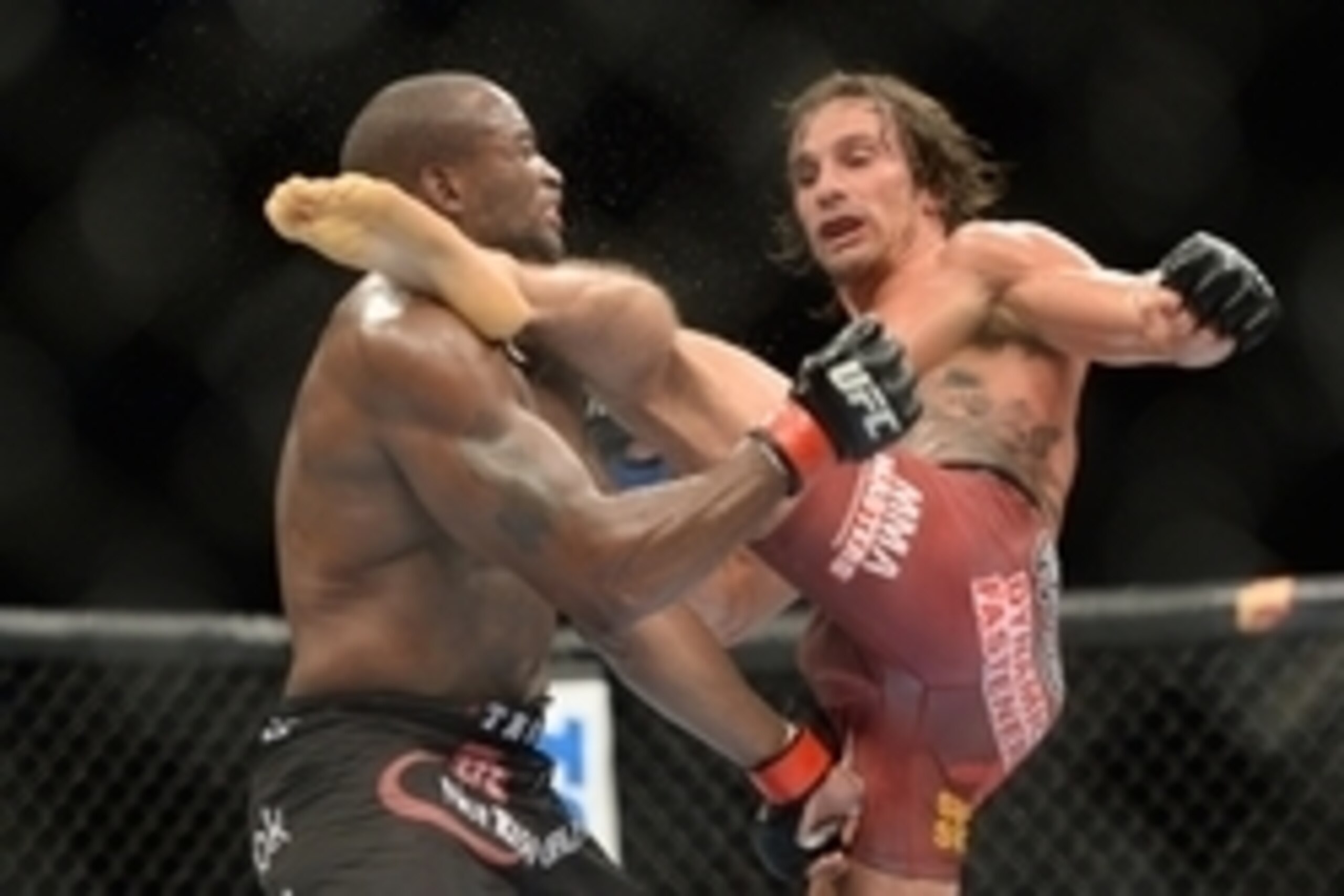 Dec 6, 2014; Las Vegas, NV, USA; Eddie Gordon (red) and Josh Samman (blue) during UFC 181 at Madalay Bay Events Center. Samman won via second round KO. Mandatory Credit: Joe Camporeale-USA TODAY Sports