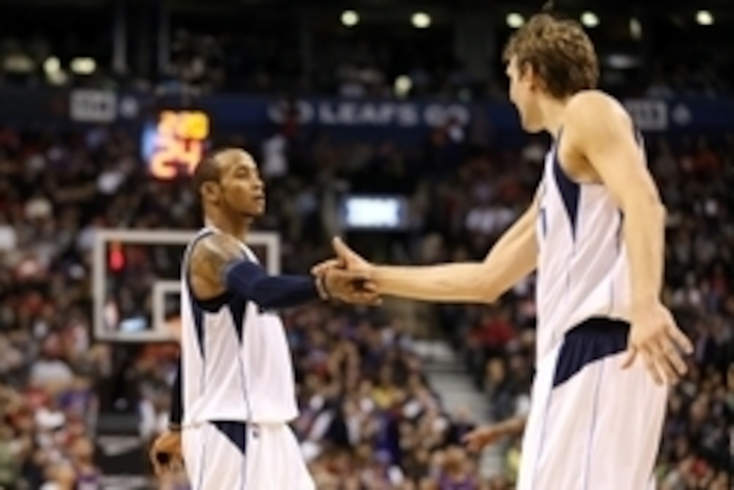 Nov 28, 2014; Toronto, Ontario, CAN; Dallas Mavericks guard Monta Ellis (11) is congratulated by forward Dirk Nowitzki (41) after hitting a three-pointer late in the fourth quarter against the Toronto Raptors at Air Canada Centre. The Mavericks beat the R Nov 28, 2014; Toronto, Ontario, CAN; Dallas Mavericks guard Monta Ellis (11) is congratulated by forward Dirk Nowitzki (41) after hitting a three-pointer late in the fourth quarter against the Toronto Raptors at Air Canada Centre. The Mavericks beat the R