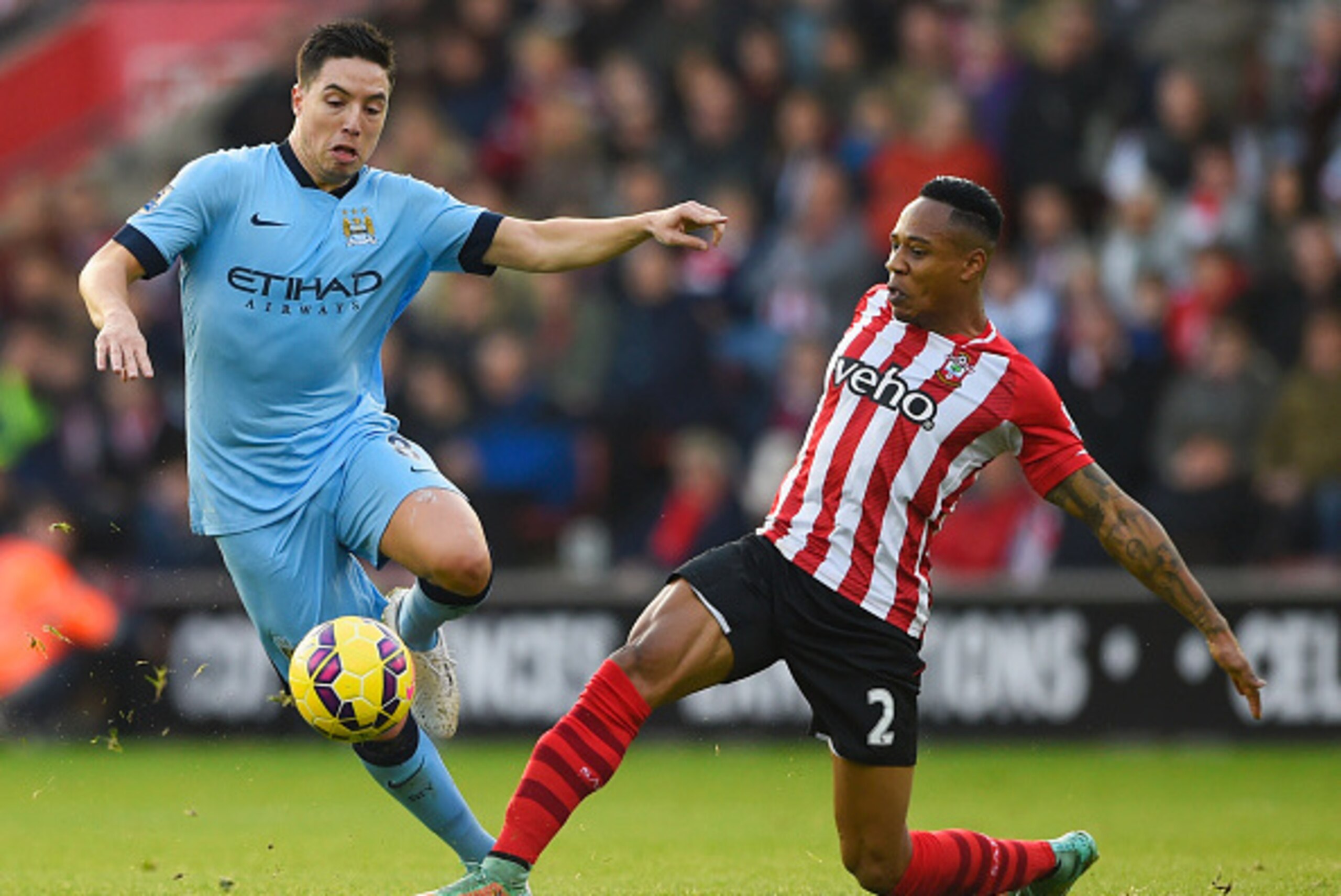 SOUTHAMPTON, ENGLAND - NOVEMBER 30: Samir Nasri of Manchester City takes on Nathaniel Clyne of Southampton during the Barclays Premier League match between Southampton and Manchester City at St Mary's Stadium on November 30, 2014 in Southampton, England. SOUTHAMPTON, ENGLAND - NOVEMBER 30: Samir Nasri of Manchester City takes on Nathaniel Clyne of Southampton during the Barclays Premier League match between Southampton and Manchester City at St Mary's Stadium on November 30, 2014 in Southampton, England.