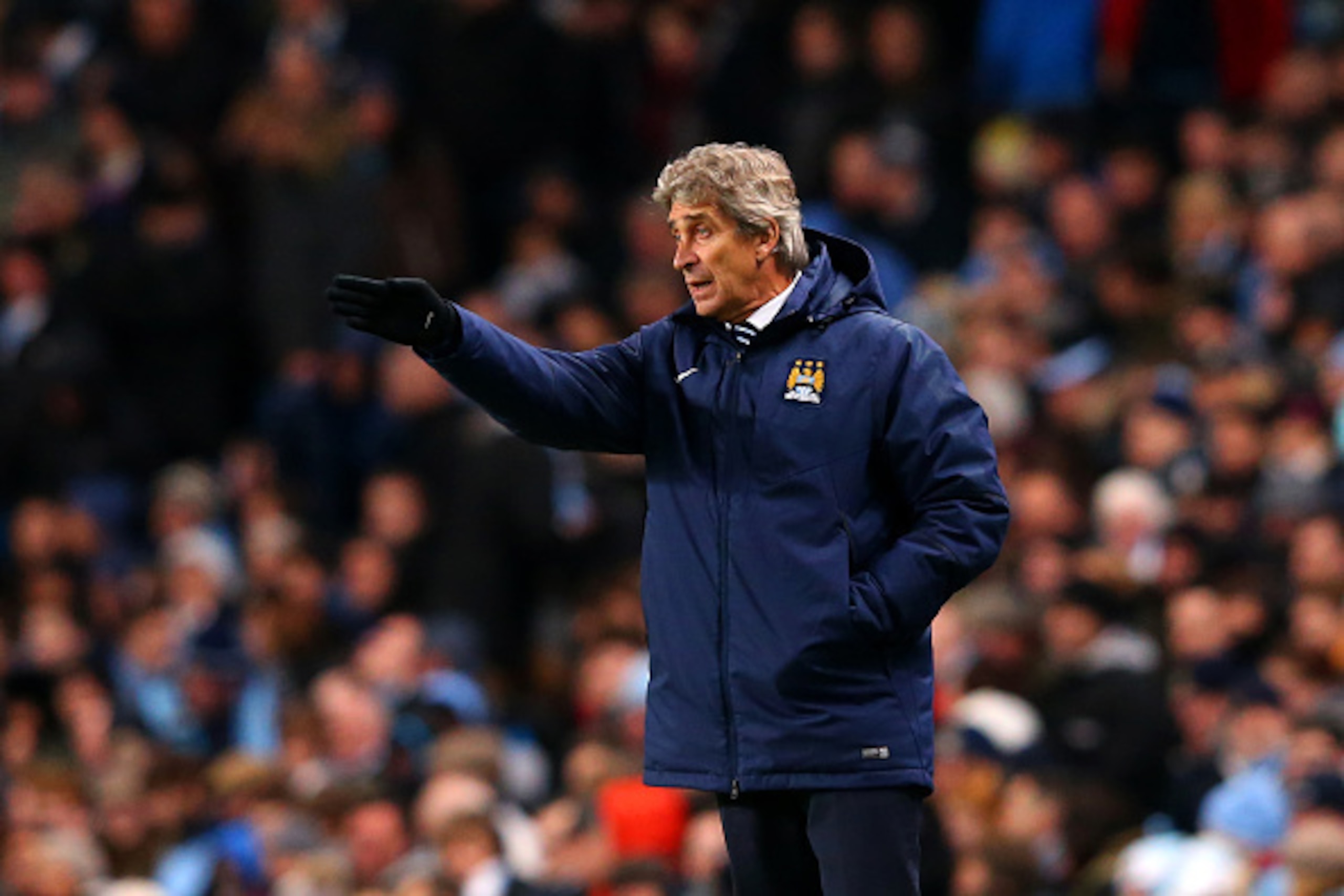 MANCHESTER, ENGLAND - DECEMBER 06:  Manuel Pellegrini, manager of Manchester City issues instructions to his players during the Barclays Premier League match between Manchester City and Everton at Etihad Stadium on December 6, 2014 in Manchester, England.