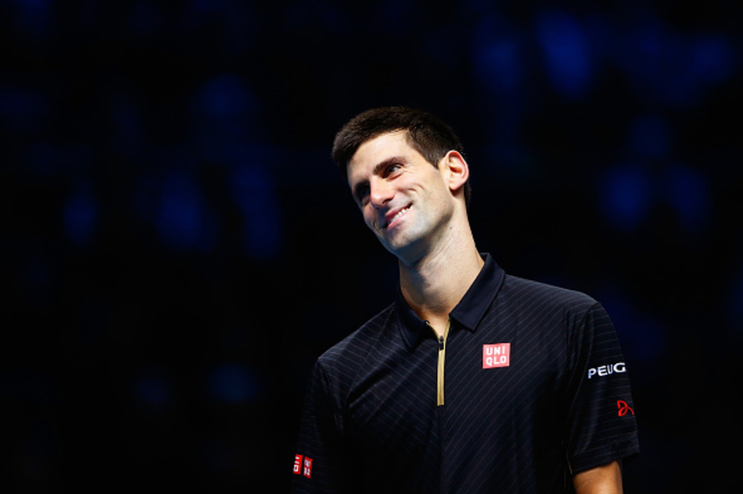 LONDON, ENGLAND - NOVEMBER 16:  Novak Djokovic of Serbia smiles during the exhibition match against Andy Murray of Great Britain on day eight of the Barclays ATP World Tour Finals at O2 Arena on November 16, 2014 in London, England. The Singles final was 