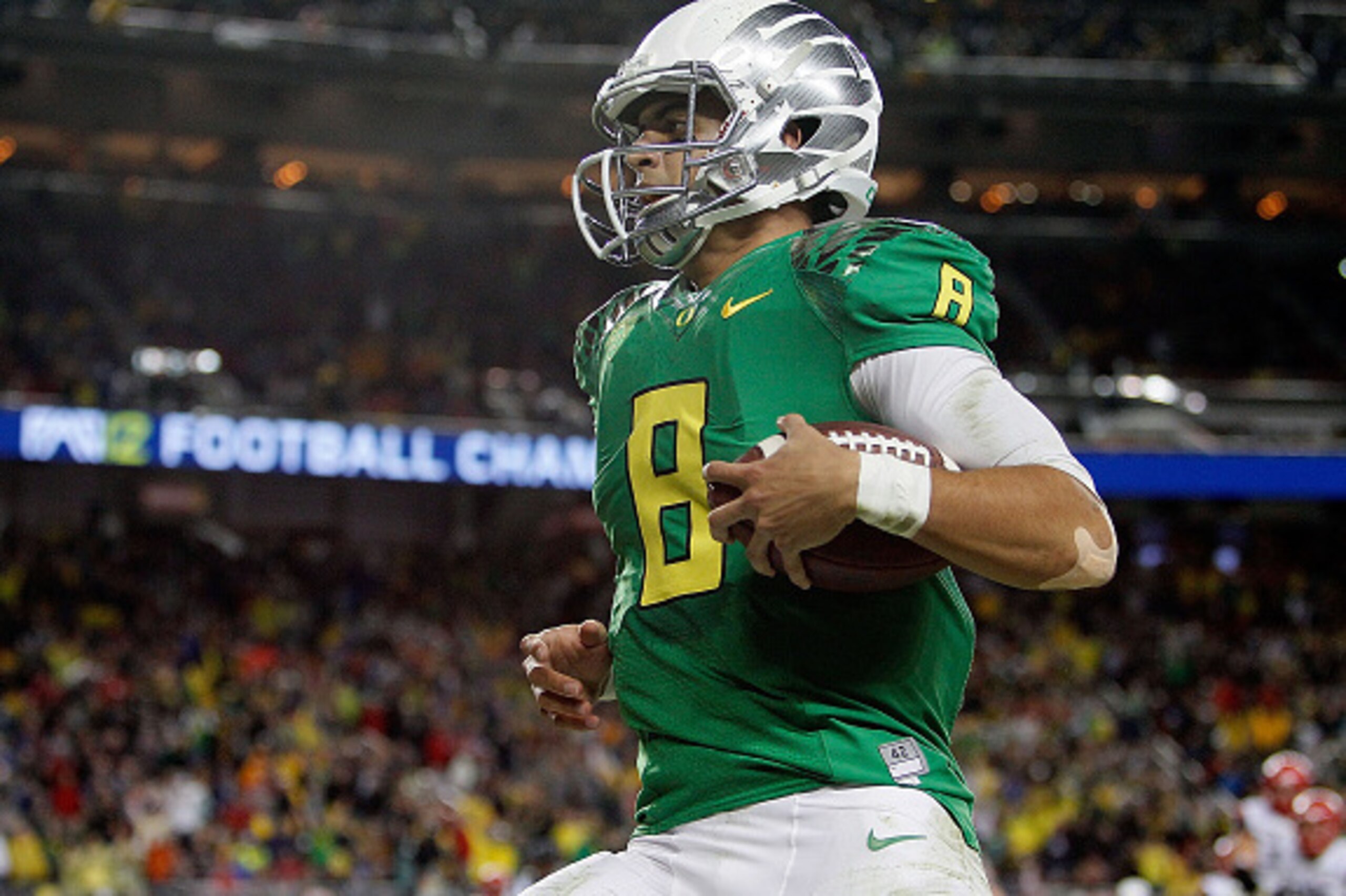 SANTA CLARA, CA - DECEMBER 05: Marcus Mariota #8 of the Oregon Ducks scrambles for a touchdown against the Arizona Wildcats during the first half of the PAC-12 Championships at Levi's Stadium on December 5, 2014 in Santa Clara, California. (Photo by Brian