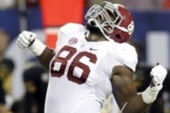 Dec 6, 2014; Atlanta, GA, USA; Alabama Crimson Tide defensive lineman A'Shawn Robinson (86) celebrates a defensive play against the Missouri Tigers in the third quarter of the 2014 SEC Championship Game at the Georgia Dome. Mandatory Credit: Brett Davis-U