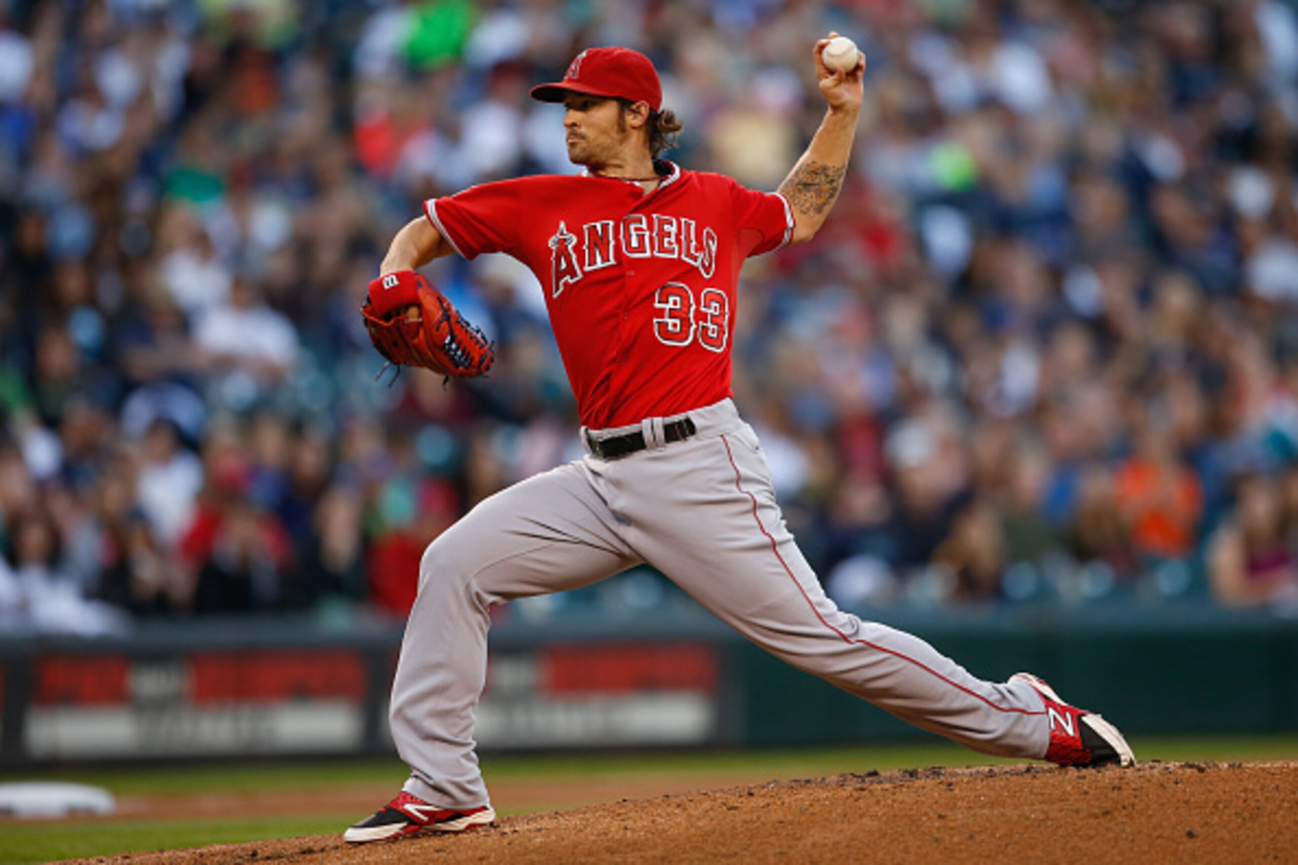 SEATTLE, WA - SEPTEMBER 27:  Starting pitcher C.J. Wilson #33 of the Los Angeles Angels of Anaheim pitches against the Seattle Mariners in the first inning at Safeco Field on September 27, 2014 in Seattle, Washington.  (Photo by Otto Greule Jr/Getty Image