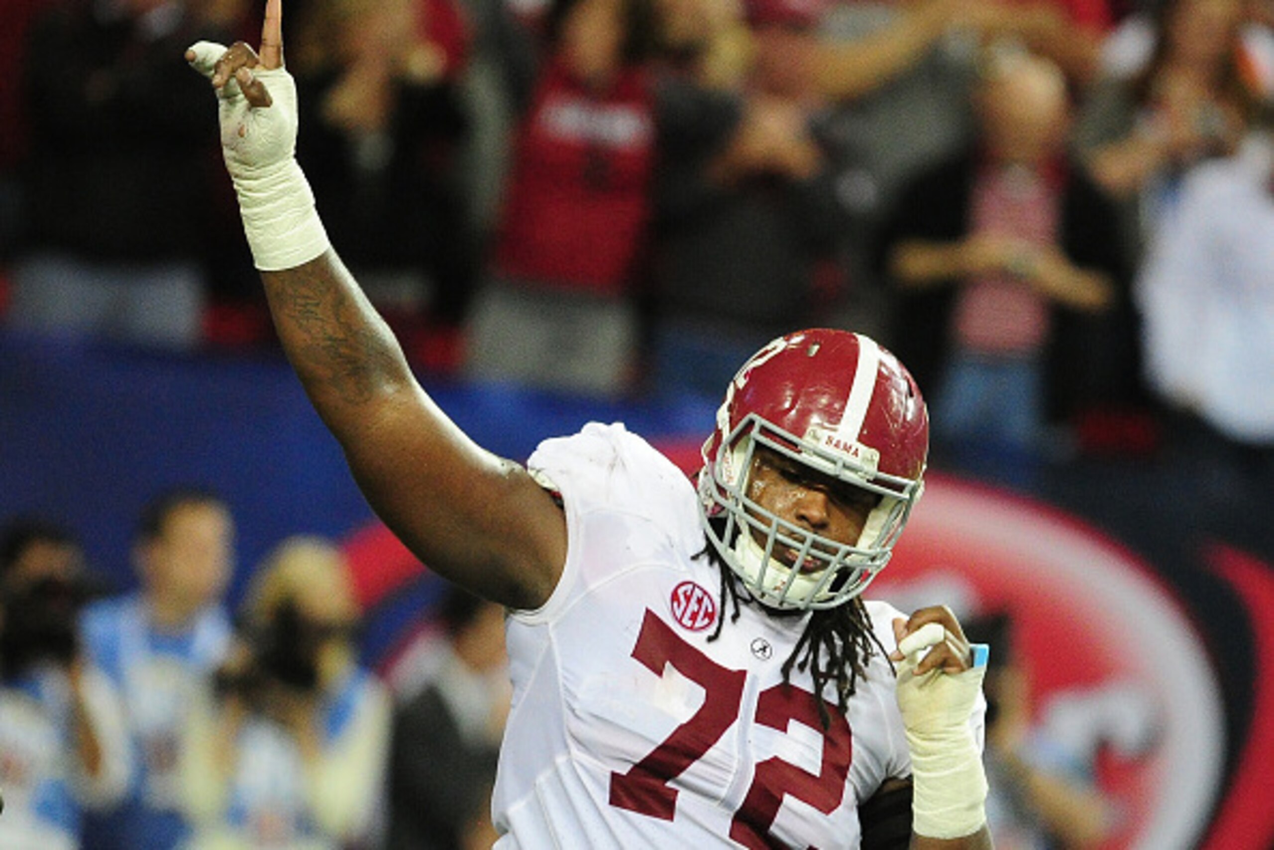 ATLANTA, GA - DECEMBER 06: Leon Brown #72 of the Alabama Crimson Tide celebrates after a score against the Missouri Tigers during the SEC Championship game at the Georgia Dome on December 6, 2014 in Atlanta, Georgia. (Photo by Scott Cunningham/Getty Image
