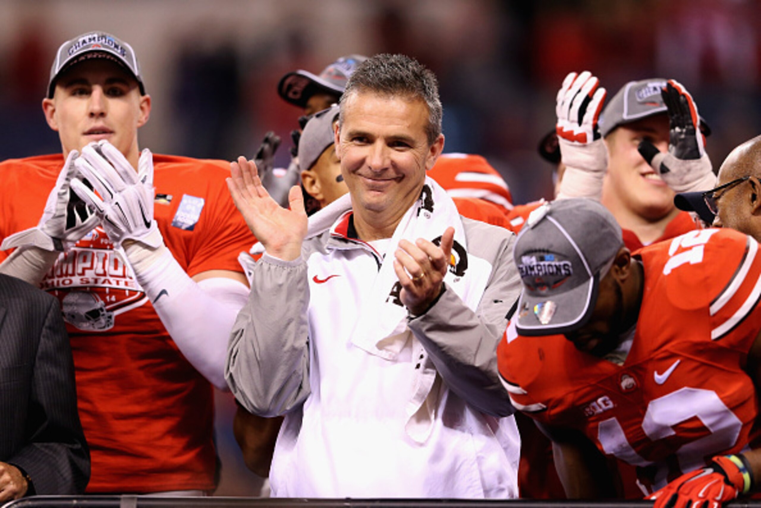 INDIANAPOLIS, IN - DECEMBER 06:  Head coach Urban Meyer of the Ohio State Buckeyes celebrates after his team defeated the Wisconsin Badgers 59-0 in the Big Ten Championship at Lucas Oil Stadium on December 6, 2014 in Indianapolis, Indiana.  (Photo by Andy
