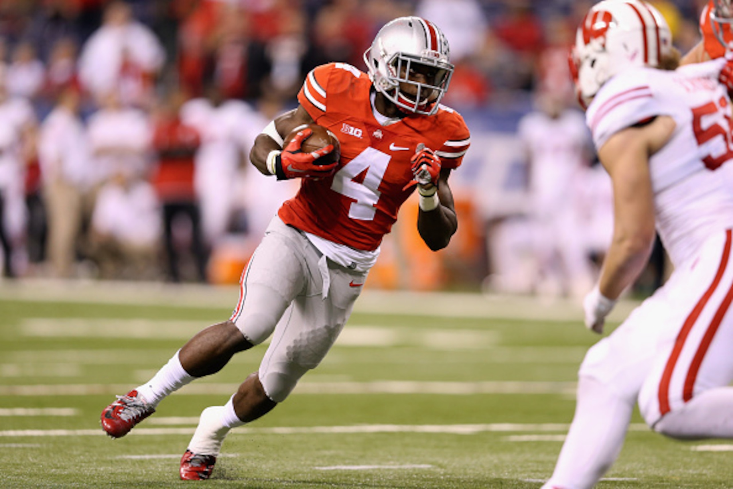 INDIANAPOLIS, IN - DECEMBER 06:  Curtis Samuel #4 of the Ohio State Buckeyes runs with the ball against the Wisconsin Badgers  during the fourth quarter of the Big Ten Championship at Lucas Oil Stadium on December 6, 2014 in Indianapolis, Indiana.  The Bu