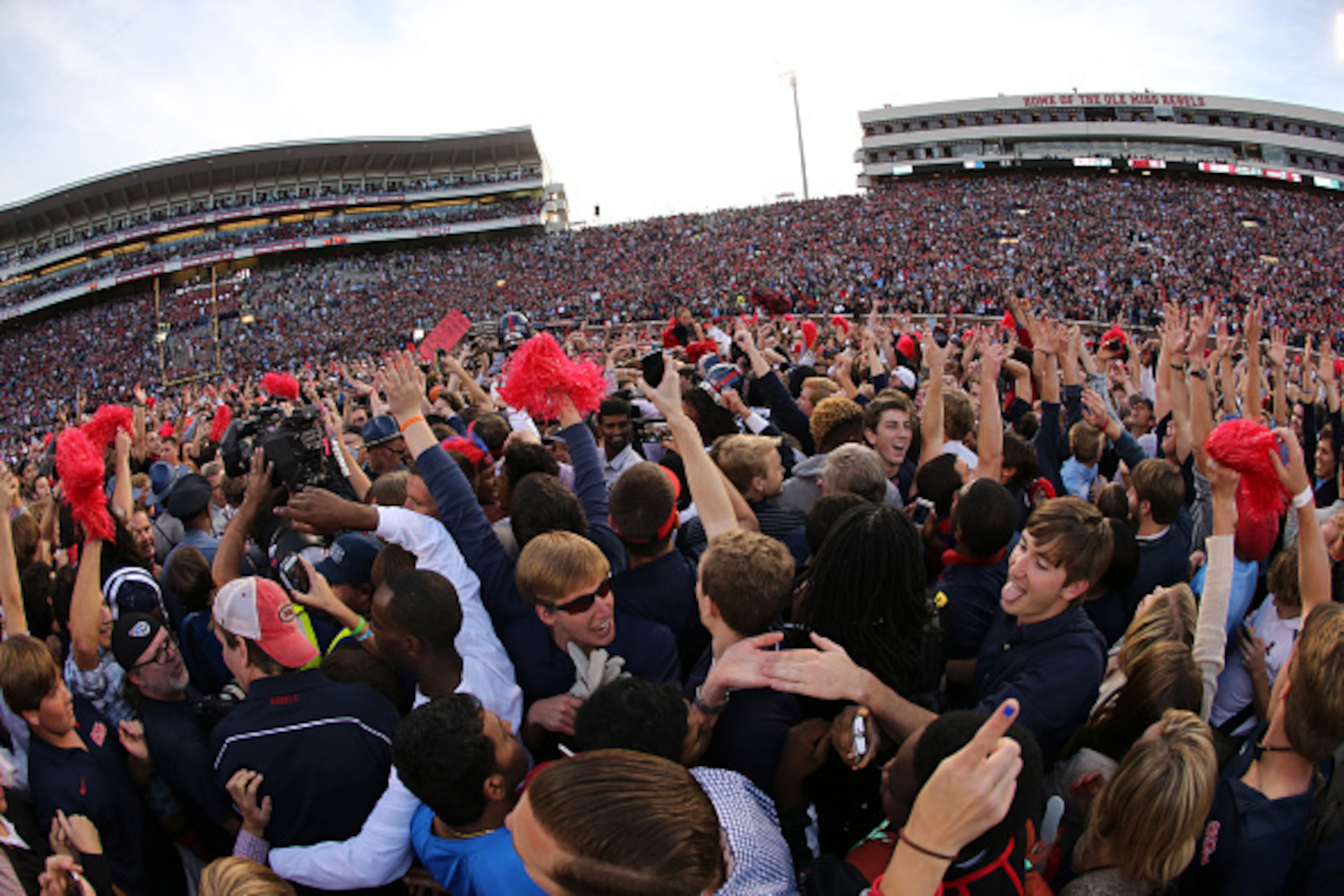 OXFORD, MS - OCTOBER 4: Fans of the Ole Miss Rebels rush the field to celebrate the victory over the Alabama Crimson Tide on October 4, 2014 at Vaught-Hemingway Stadium in Oxford, Mississippi. Mississippi beat Alabama 23-17. (Photo by Joe Murphy/Getty Ima