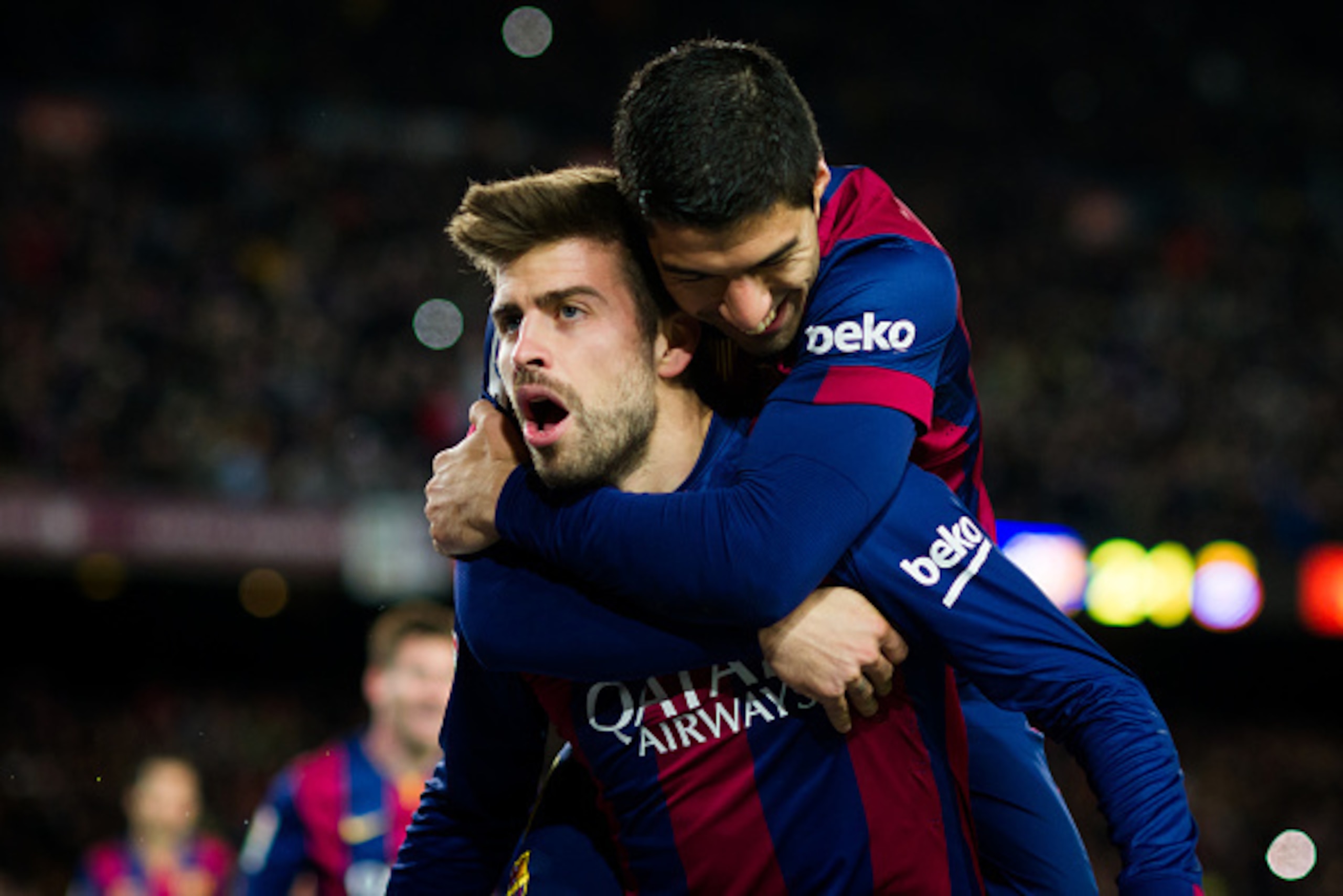 BARCELONA, SPAIN - DECEMBER 07: Gerard Pique (L) of FC Barcelona celebrates with his teammate Luis Suarez after scoring his team's third goal during the La Liga match between FC Barcelona and RCD Espanyol at Camp Nou on December 7, 2014 in Barcelona, Spai BARCELONA, SPAIN - DECEMBER 07: Gerard Pique (L) of FC Barcelona celebrates with his teammate Luis Suarez after scoring his team's third goal during the La Liga match between FC Barcelona and RCD Espanyol at Camp Nou on December 7, 2014 in Barcelona, Spai