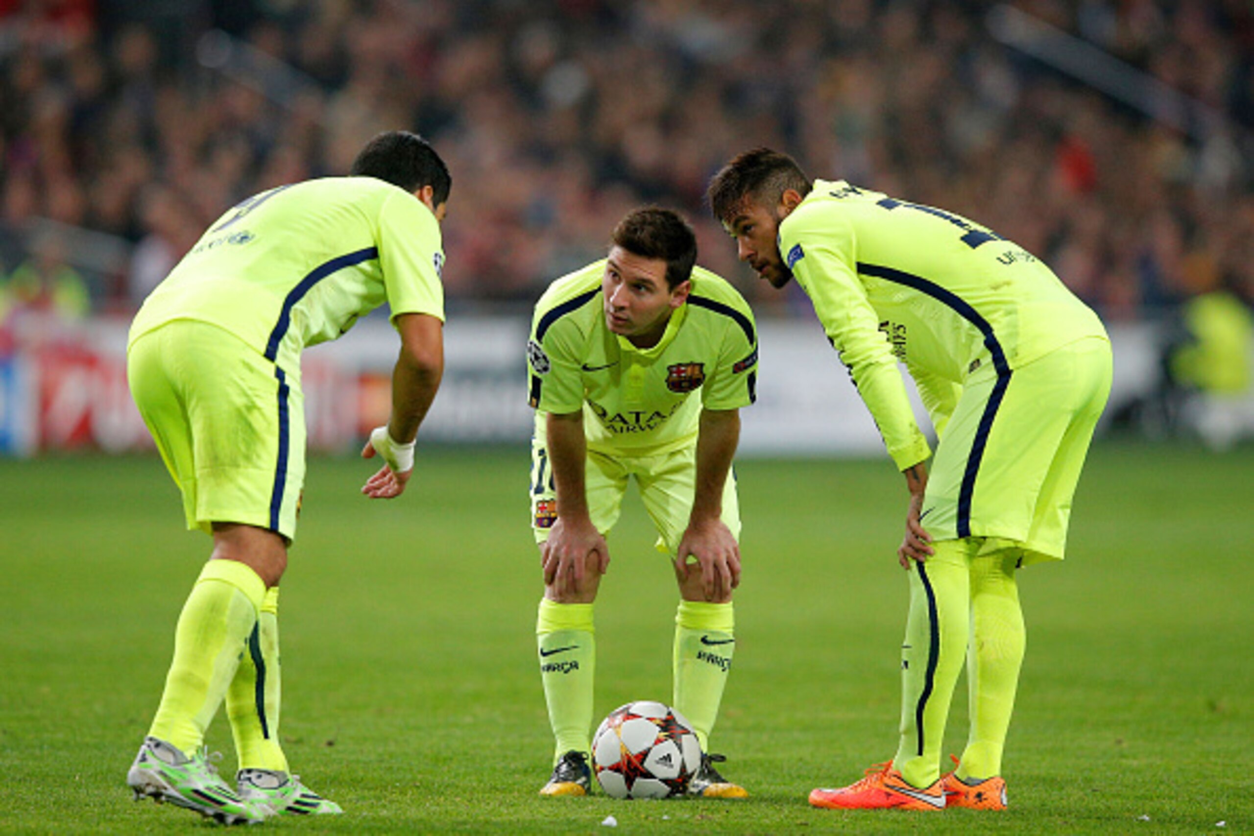 AMSTERDAM, NETHERLANDS - NOVEMBER 05:  (L-R) Luis Suarez, Lionel Messi and Neymar of Barcelona discuss a free kick during the UEFA Champions League Group F match between AFC Ajax and FC Barcelona at The Amsterdam Arena on November 5, 2014 in Amsterdam, Ne