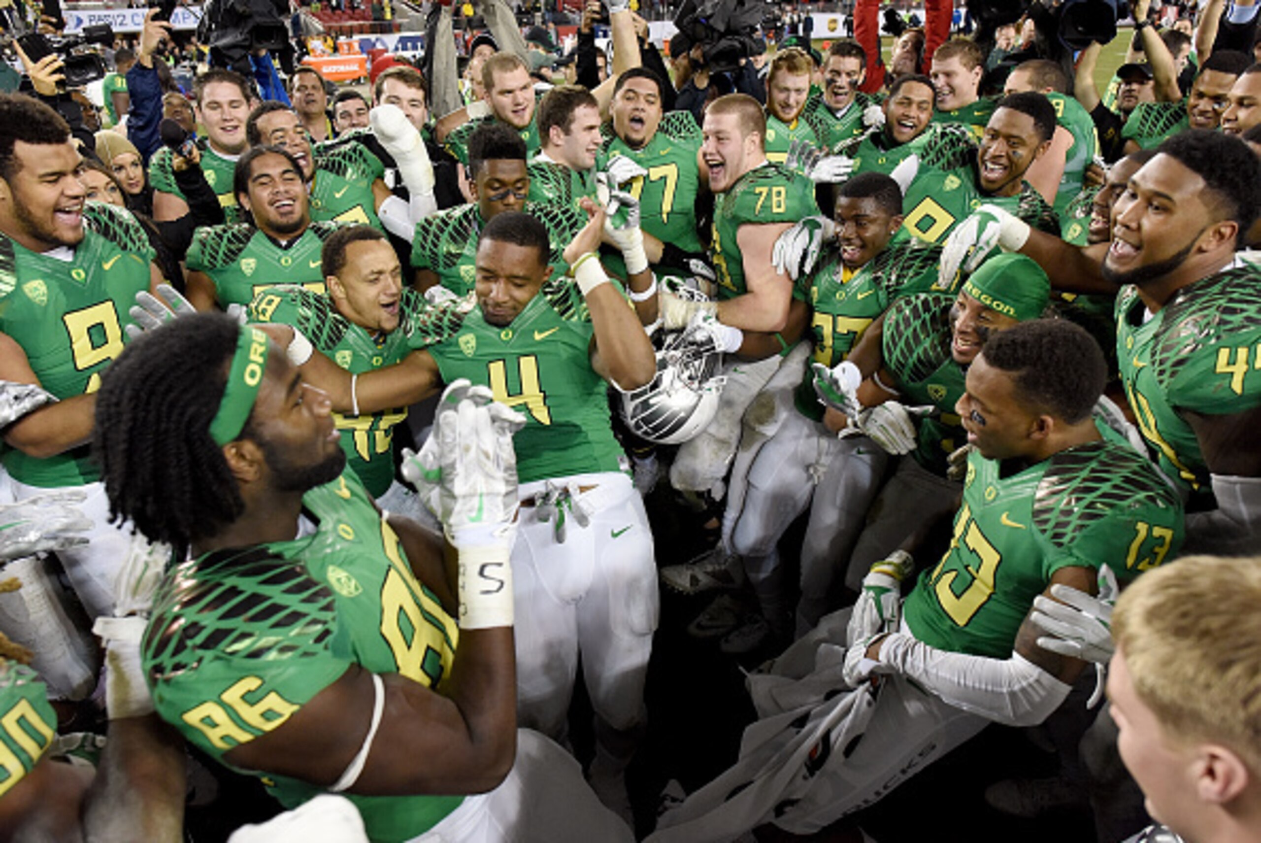 SANTA CLARA, CA - DECEMBER 05: Oregon Ducks players celebrates winning the Pac-12 Championship game over the Arizona Wildcats at Levi's Stadium on December 5, 2014 in Santa Clara, California. The Ducks defeated the Wildcats 51-13. (Photo by Thearon W. H SANTA CLARA, CA - DECEMBER 05: Oregon Ducks players celebrates winning the Pac-12 Championship game over the Arizona Wildcats at Levi's Stadium on December 5, 2014 in Santa Clara, California. The Ducks defeated the Wildcats 51-13. (Photo by Thearon W. H