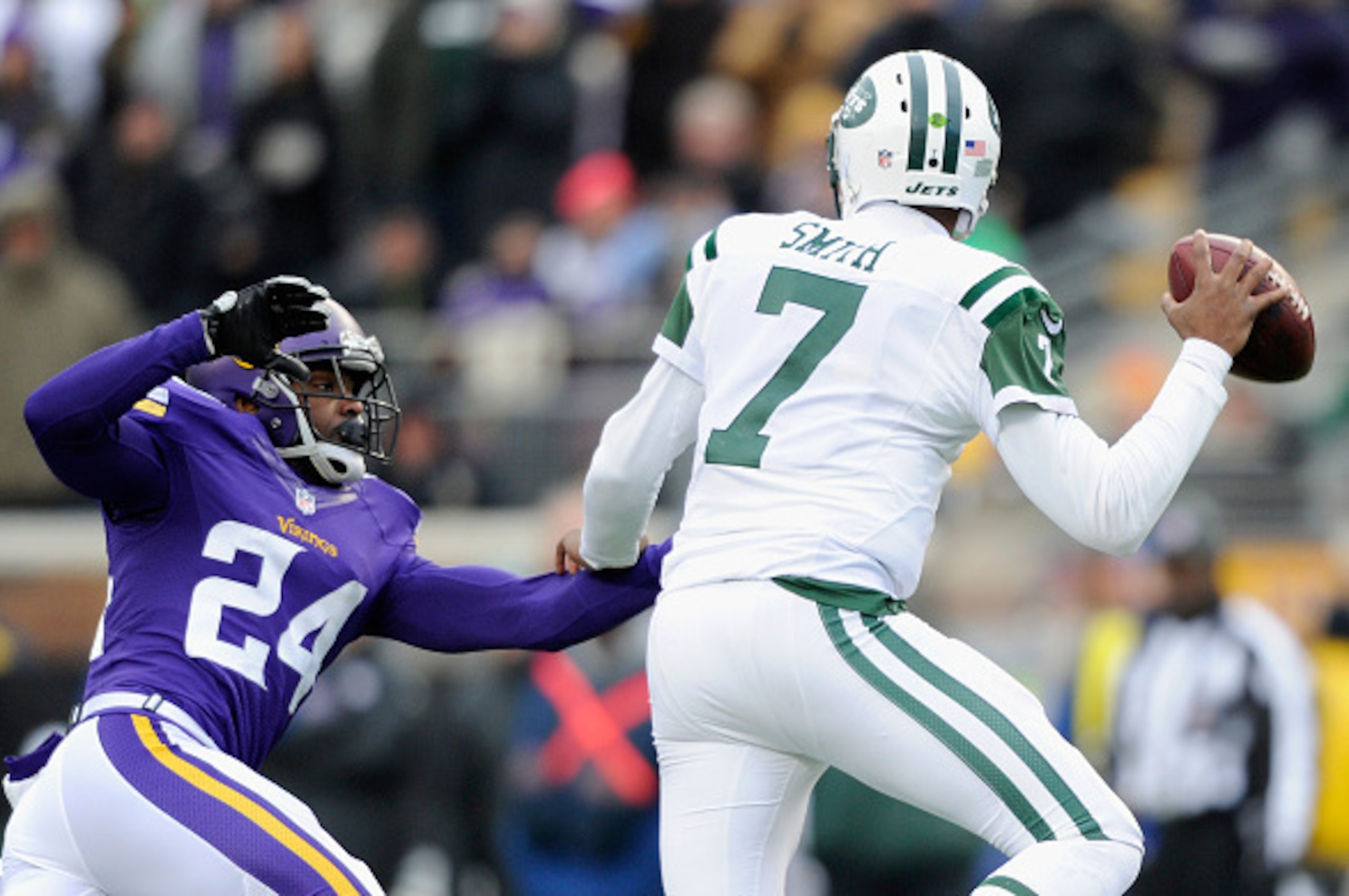MINNEAPOLIS, MN - DECEMBER 7: Captain Munnerlyn #24 of the Minnesota Vikings puts pressure on quarterback Geno Smith #7 of the New York Jets during the fourth quarter of the game on December 7, 2014 at TCF Bank Stadium in Minneapolis, Minnesota. The Vikin