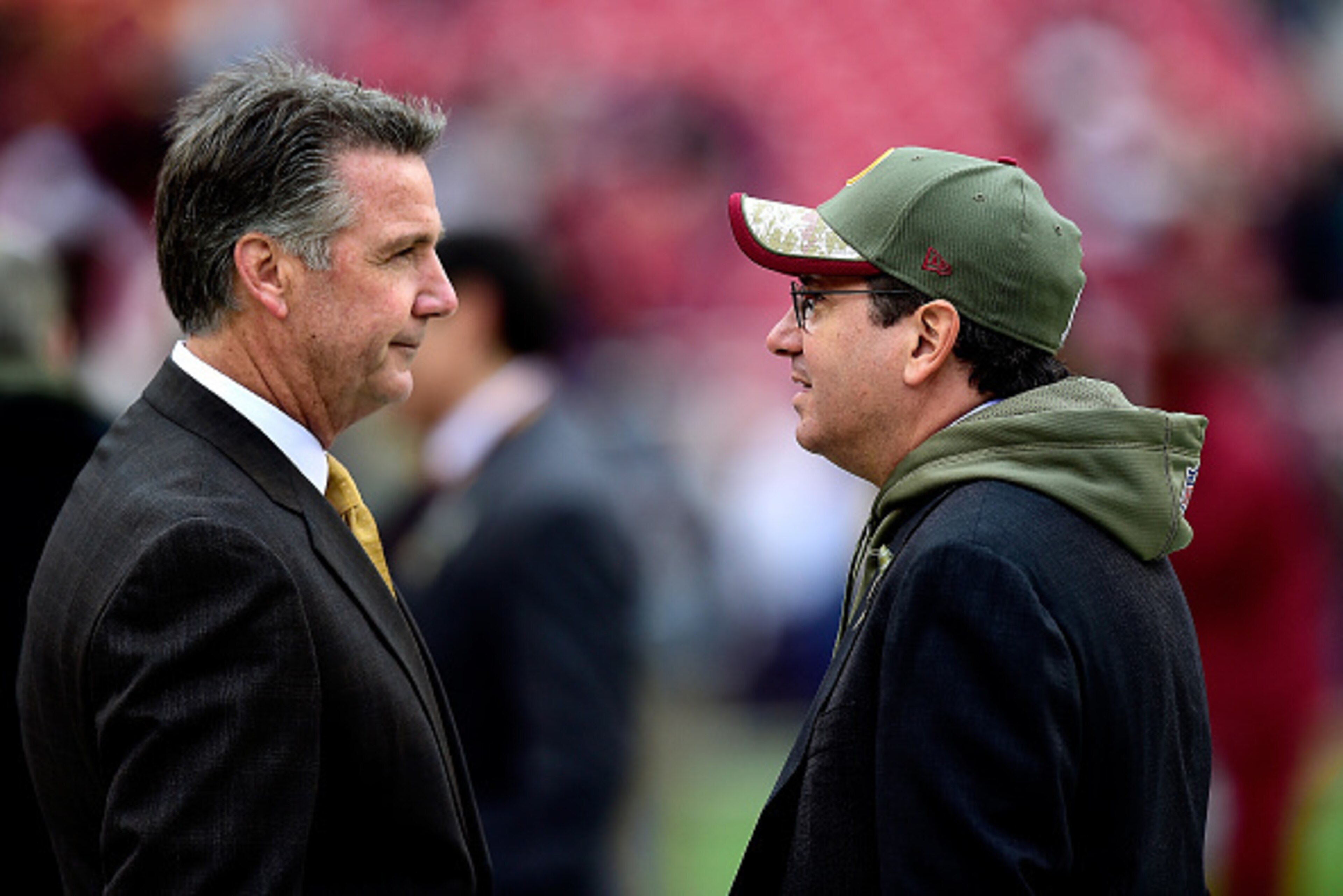 LANDOVER, MD - NOVEMBER 16:  Washington Redskins Owner Dan Snyder (R) speaks with General Manager Bruce Allen before a game against the Tampa Bay Buccaneers at FedExField on November 16, 2014 in Landover, Maryland.  (Photo by Patrick McDermott/Getty Image