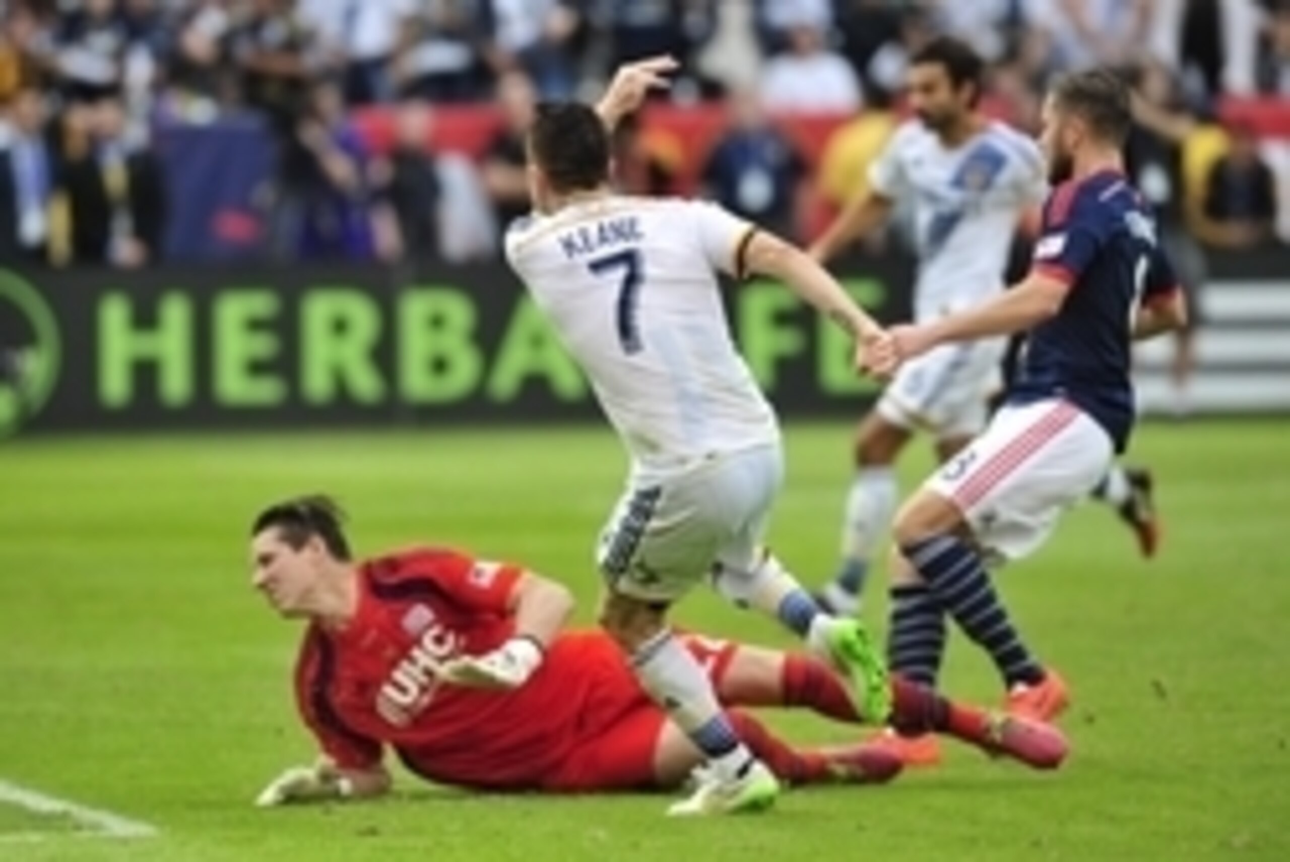 Dec 7, 2014; Los Angeles, CA, USA; Los Angeles Galaxy forward Robbie Keane (7) scores a goal past New England Revolution goalkeeper Bobby Shuttleworth (22) in the overtime during the 2014 MLS Cup final at Stubhub Center. Mandatory Credit: Gary A. Vasquez-