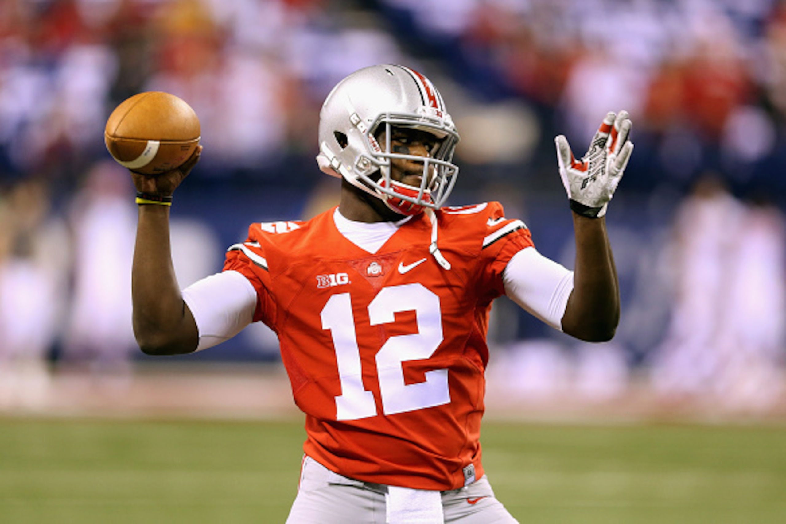 INDIANAPOLIS, IN - DECEMBER 06:  Quarterback Cardale Jones #12 of the Ohio State Buckeyes warms up prior to the game against the Wisconsin Badgers in the Big Ten Championship at Lucas Oil Stadium on December 6, 2014 in Indianapolis, Indiana.  (Photo by An
