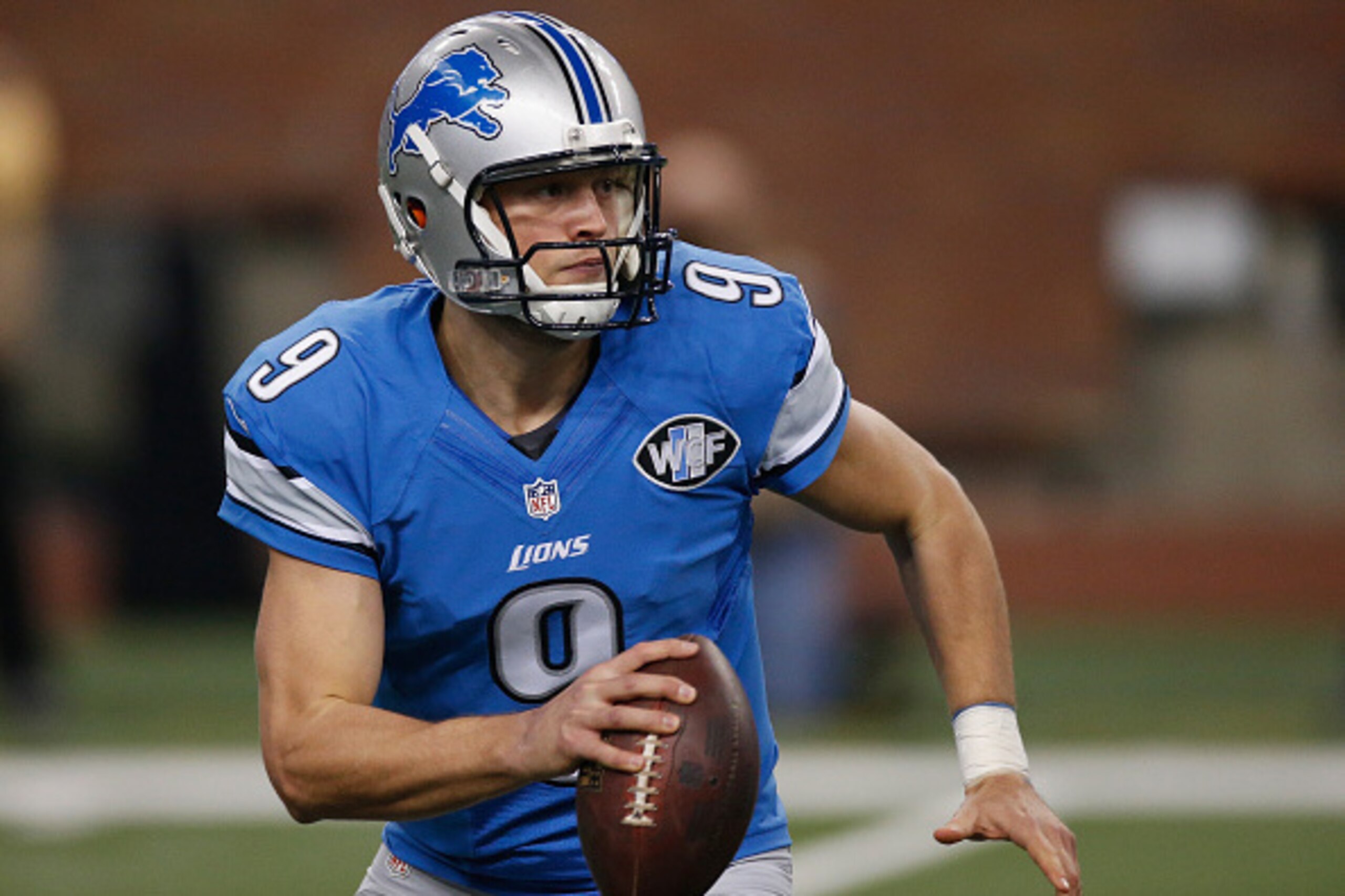 DETROIT, MI - DECEMBER 07: Matthew Stafford #9 of the Detroit Lions looks to throw a first quarter pass against the  Tampa Bay Buccaneers at Ford Field on December 07, 2014 in Detroit, Michigan. (Photo by Gregory Shamus/Getty Images)