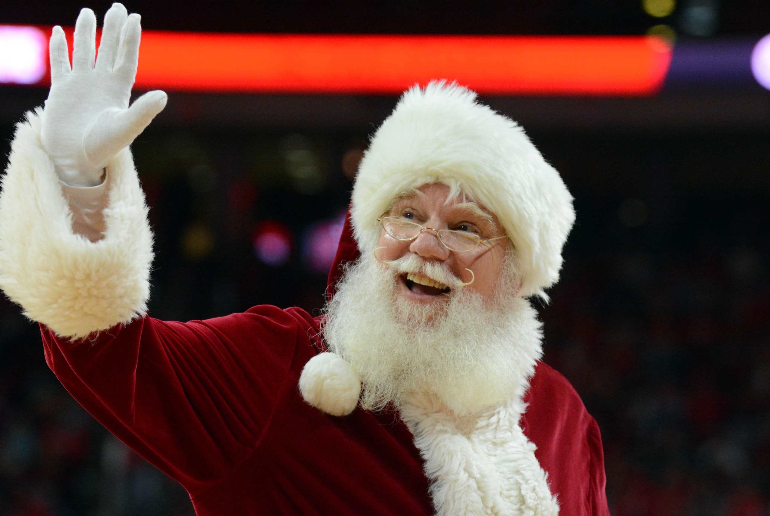 Dec 6, 2014; Raleigh, NC, USA; Santa Claus waves to the crowd during a break in the second half between the Wake Forest Deamon Deacons and North Carolina State Wolfpack at PNC Arena.  North Carolina State won 78-65.   Mandatory Credit: Rob Kinnan-USA Toda
