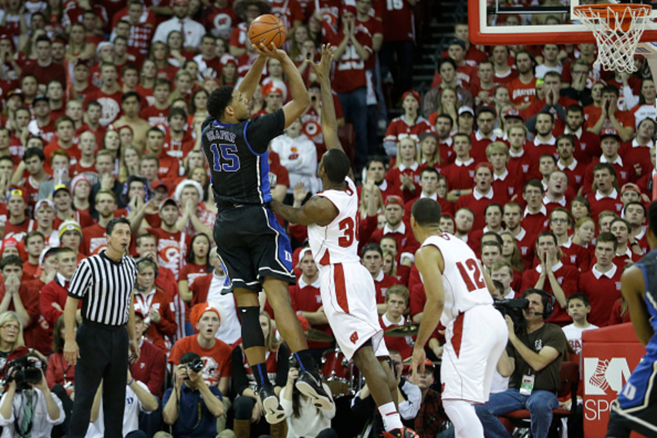 MADISON, WI - DECEMBER 03: Jahlil Okafor #15 of the Duke Blue Devils pulls up for a two pointer during the second half against the Wisconsin Badgers at Kohl Center on December 03, 2014 in Madison, Wisconsin. (Photo by Mike McGinnis/Getty Images)