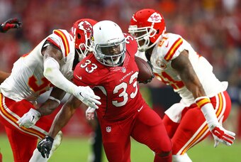 Dec 7, 2014; Glendale, AZ, USA; Arizona Cardinals running back Kerwynn Williams (33) runs the ball in the fourth quarter against the Kansas City Chiefs at University of Phoenix Stadium. The Cardinals defeated the Chiefs 17-14. Mandatory Credit: Mark J. Re
