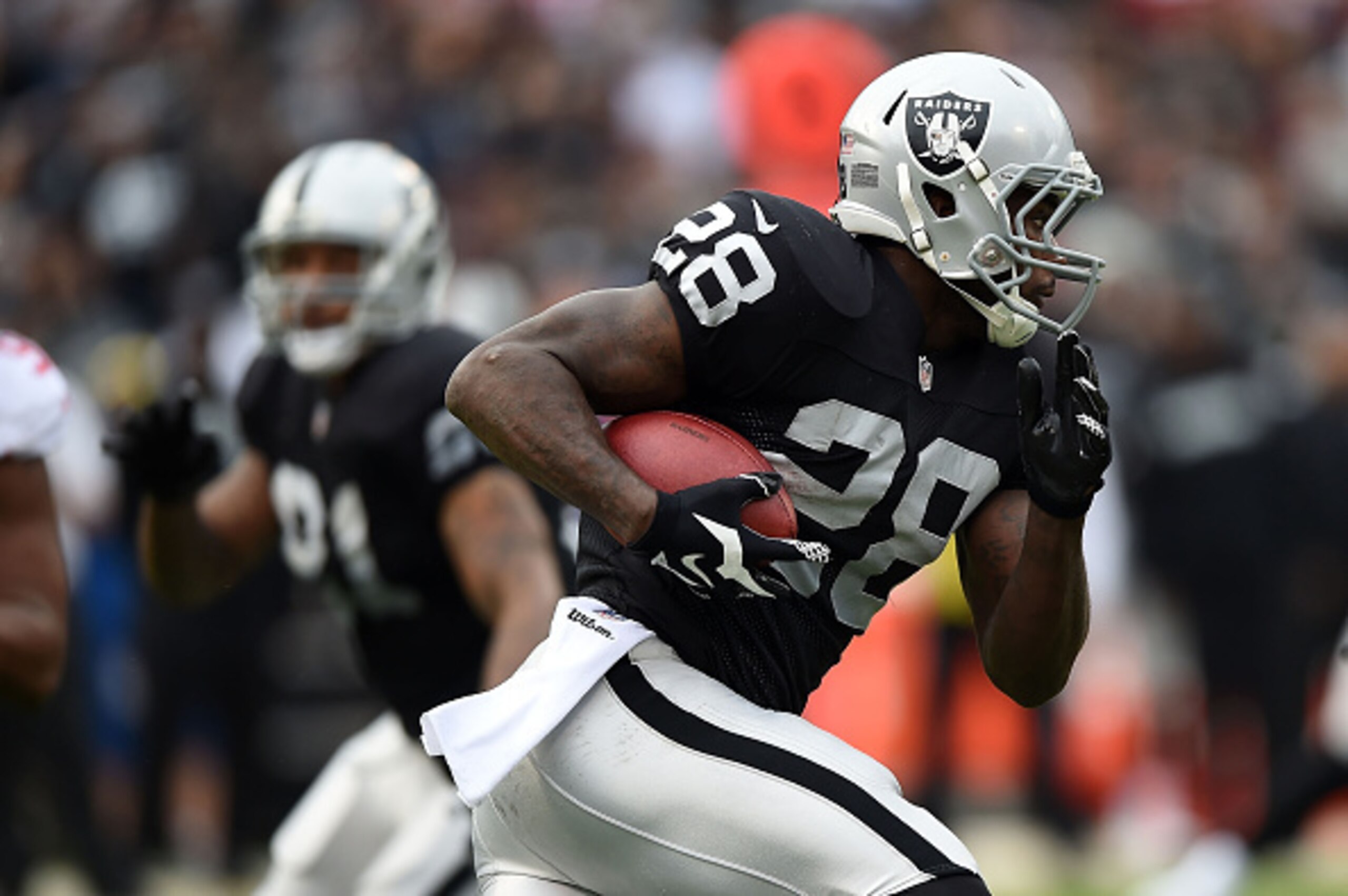 OAKLAND, CA - DECEMBER 07:  Latavius Murray #28 of the Oakland Raiders carries in the second quarter against the San Francisco 49ers at O.co Coliseum on December 7, 2014 in Oakland, California.  (Photo by Thearon W. Henderson/Getty Images)