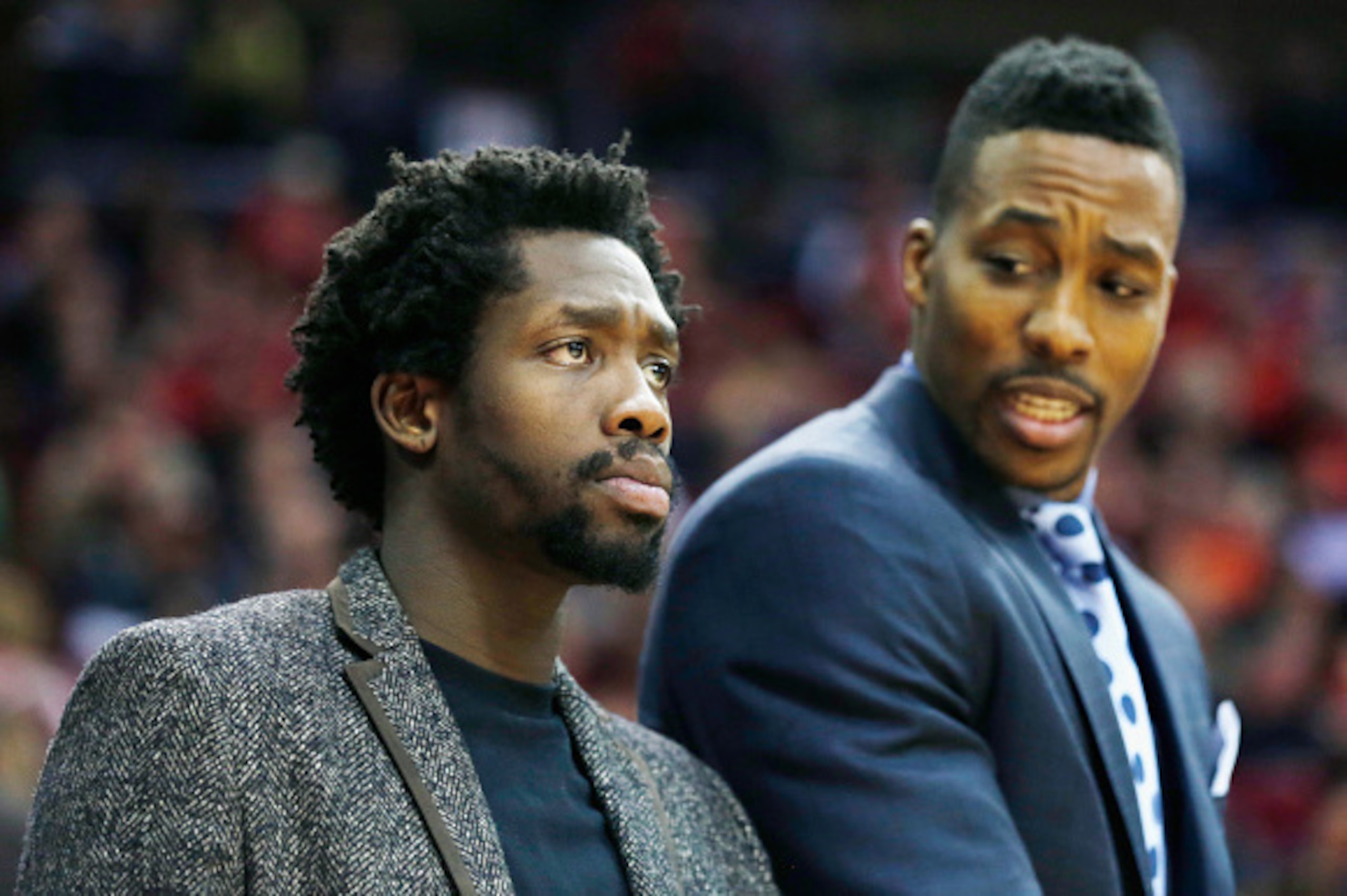 HOUSTON, TX - NOVEMBER 28:  Patrick Beverley #2 and Dwight Howard #12 of the Houston Rockets stand near the team area during their game against the Los Angeles Clippers at the Toyota Center on November 28, 2014 in Houston, Texas.  NOTE TO USER: User expre