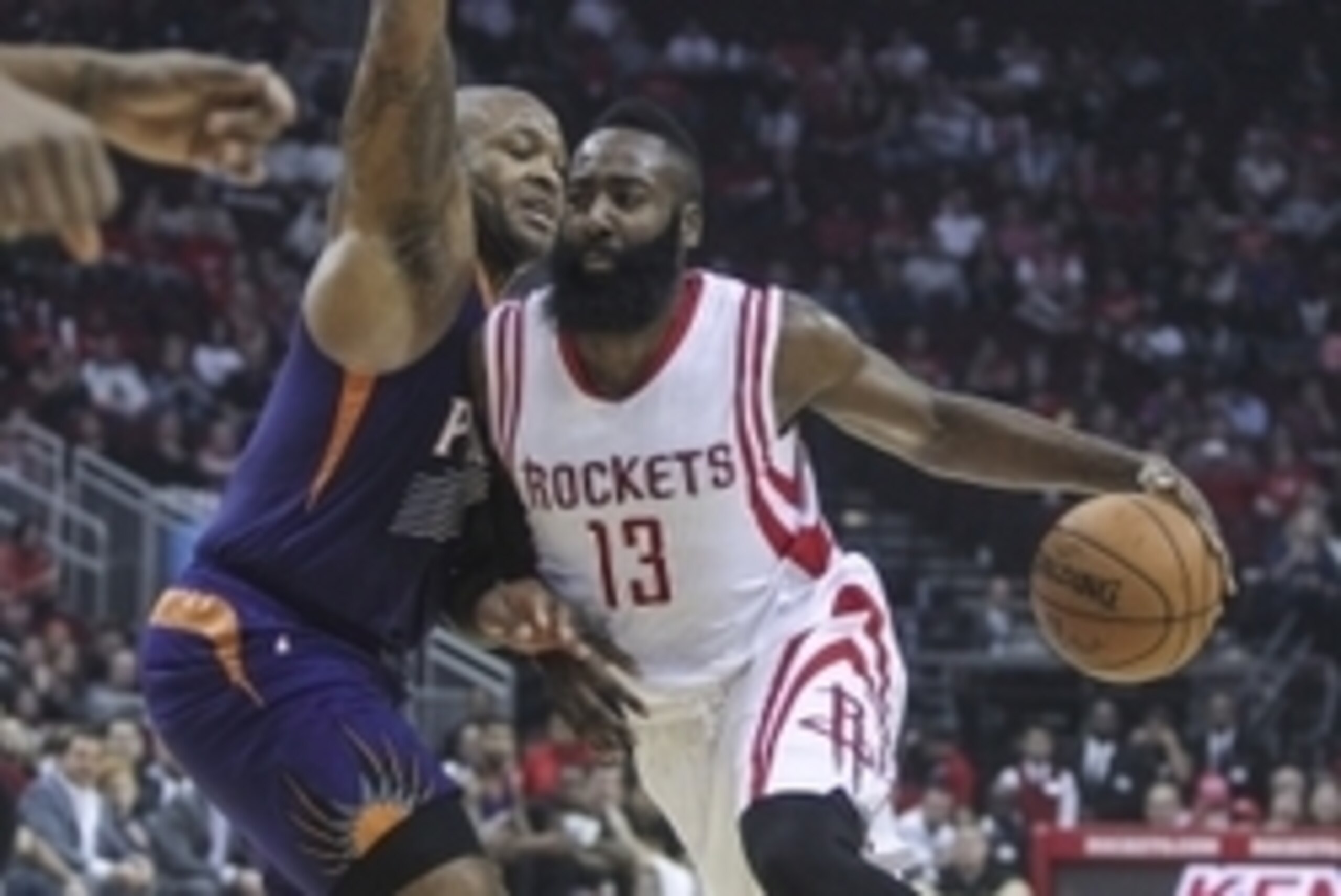 Dec 6, 2014; Houston, TX, USA; Houston Rockets guard James Harden (13) drives the ball during the first quarter as Phoenix Suns forward P.J. Tucker (17) defends at Toyota Center. Mandatory Credit: Troy Taormina-USA TODAY Sports