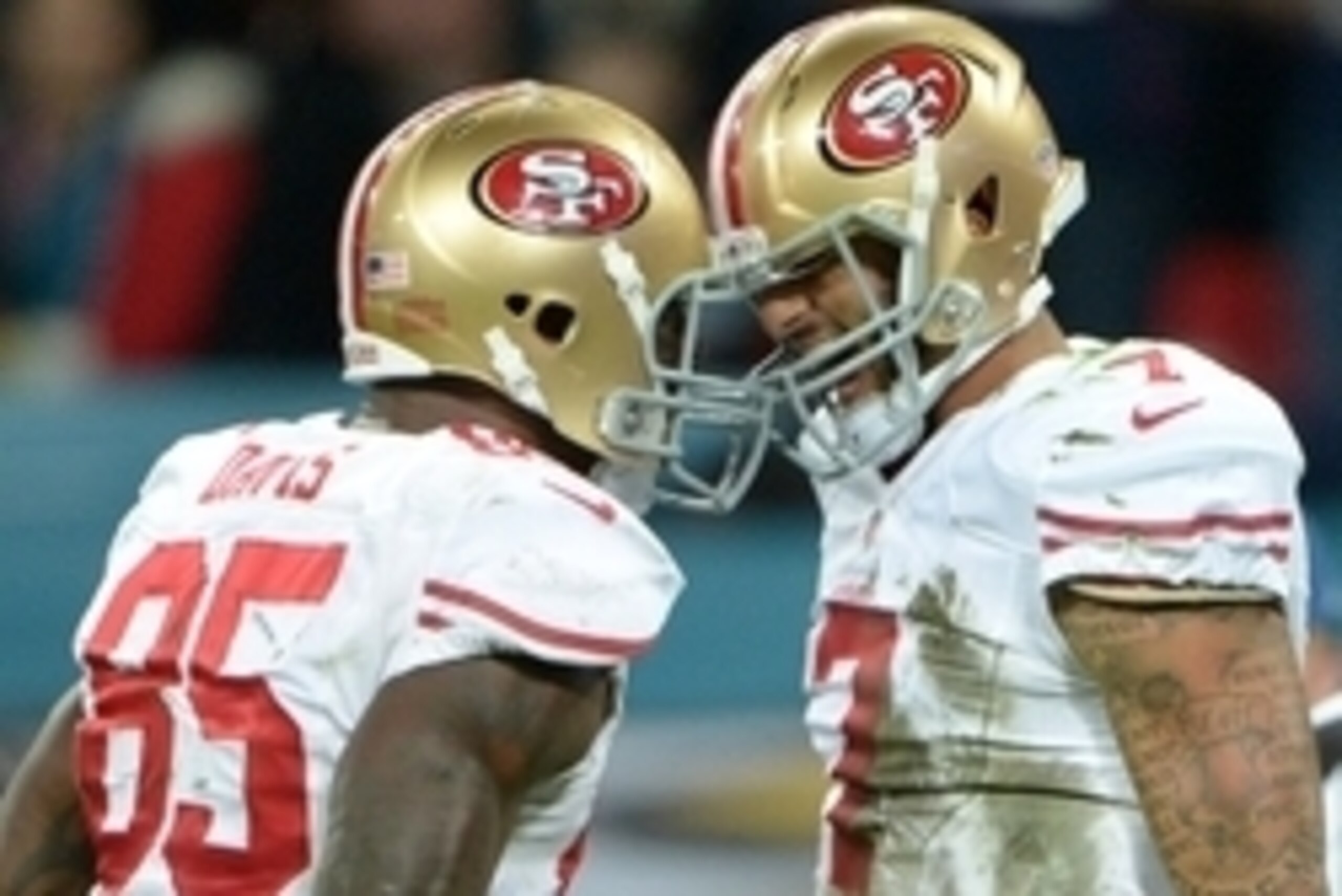 Oct 27, 2013; London, United Kingdom; San Francisco 49ers quarterback Colin Kaepernick (7) celebrates with tight end Vernon Davis (85) after scoring a touchdown against the Jacksonville Jaguars in the NFL International Series game at Wembley Stadium. Mand