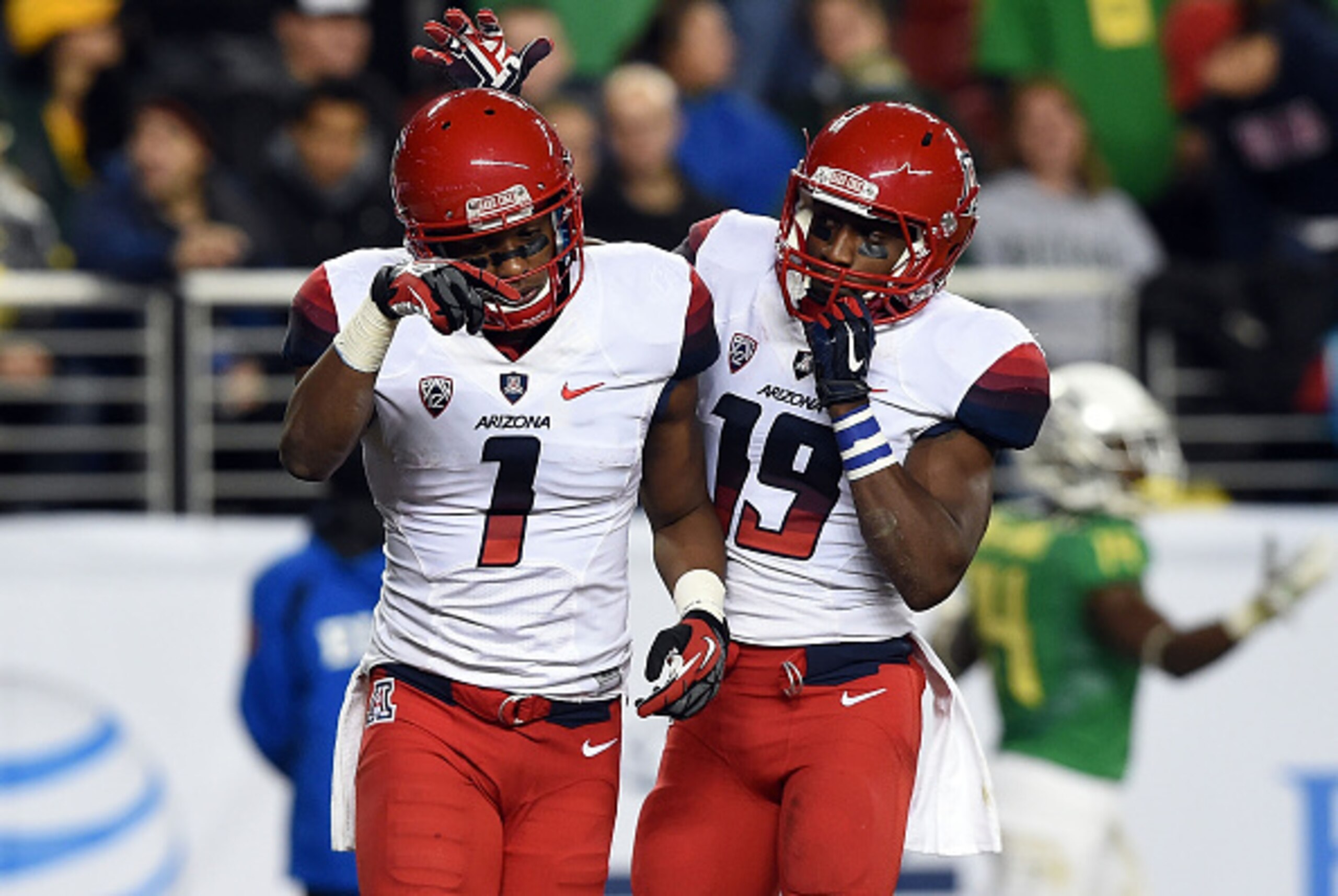 SANTA CLARA, CA - DECEMBER 05:  Davonte' Neal #19 of the Arizona Wildcats celebrates a touchdown by teammate Cayleb Jones #1 of the Arizona Wildcats at the PAC-12 Championshipsat Levi's Stadium on December 5, 2014 in Santa Clara, California.  (Photo by Th