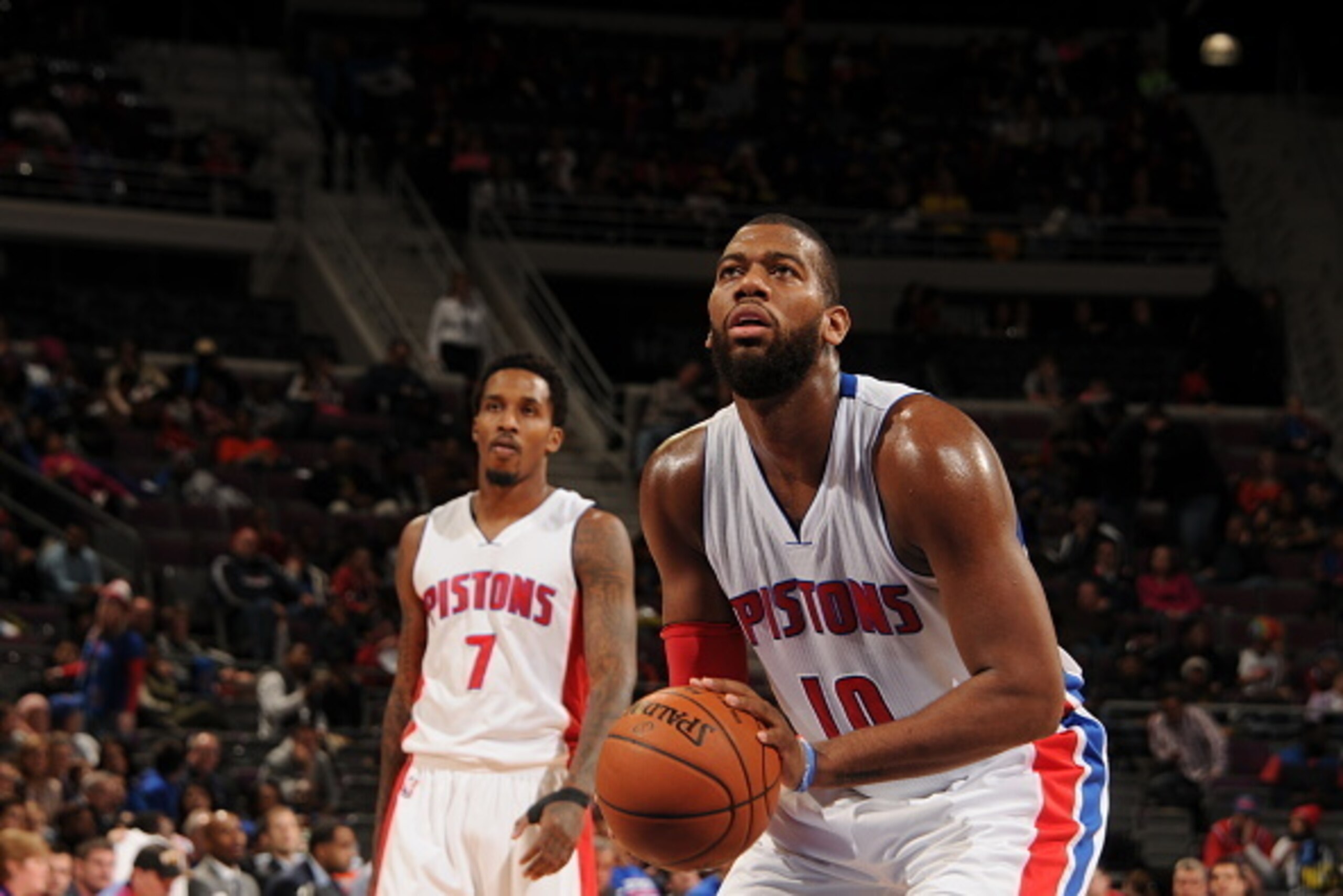 AUBURN HILLS, MI - DECEMBER 6: Greg Monroe #10 of the Detroit Pistons attempts a free throw against the Philadelphia 76ers on December 6, 2014 at The Palace of Auburn Hills in Auburn Hills, Michigan. NOTE TO USER: User expressly acknowledges and agrees th