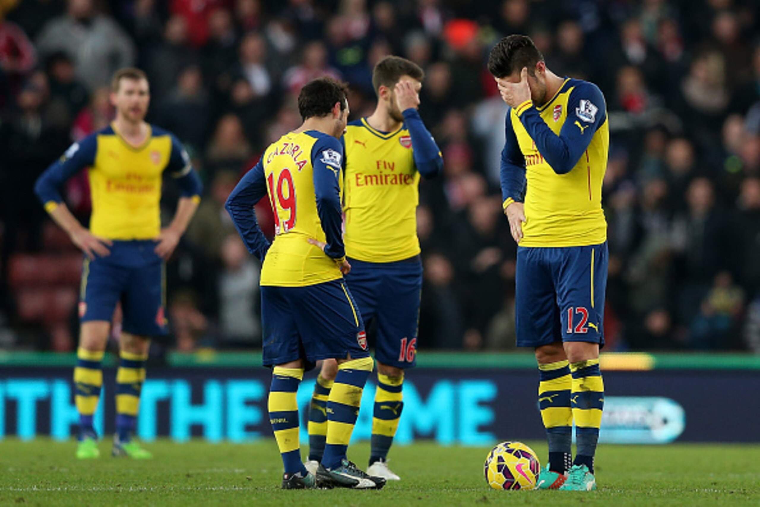 STOKE ON TRENT, ENGLAND - DECEMBER 06:  Olivier Giroud (R) and Santi Cazorla of Arsenal look dejected after coneding a third goal during the Barclays Premier League match between Stoke City and Arsenal  at the Britannia Stadium on December 6, 2014 in Stok