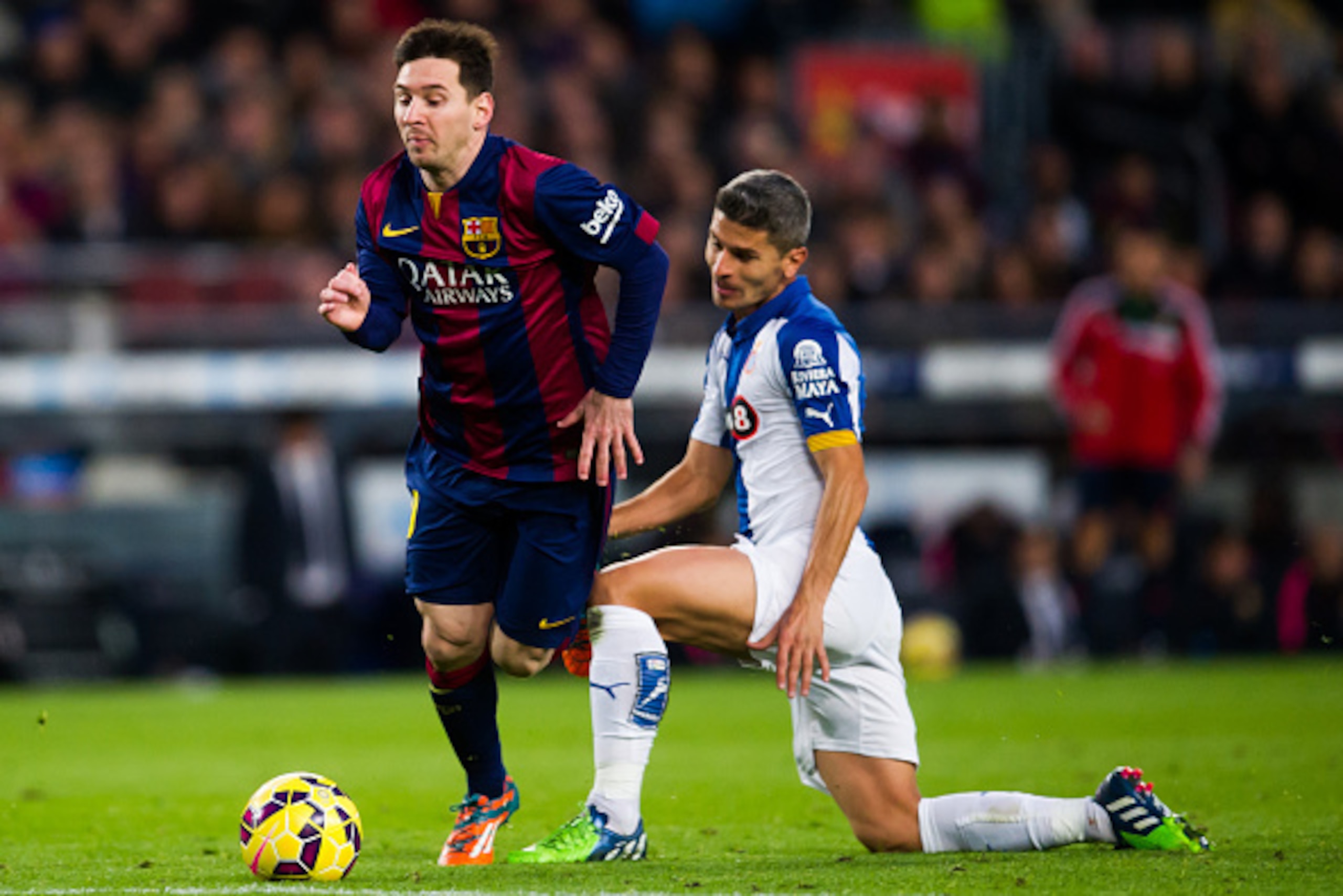 BARCELONA, SPAIN - DECEMBER 07: Lionel Messi of FC Barcelona is brought down by Salva Sevilla of RCD Espanyol during the La Liga match between FC Barcelona and RCD Espanyol at Camp Nou on December 7, 2014 in Barcelona, Spain. (Photo by Alex Caparros/Getty BARCELONA, SPAIN - DECEMBER 07: Lionel Messi of FC Barcelona is brought down by Salva Sevilla of RCD Espanyol during the La Liga match between FC Barcelona and RCD Espanyol at Camp Nou on December 7, 2014 in Barcelona, Spain. (Photo by Alex Caparros/Getty