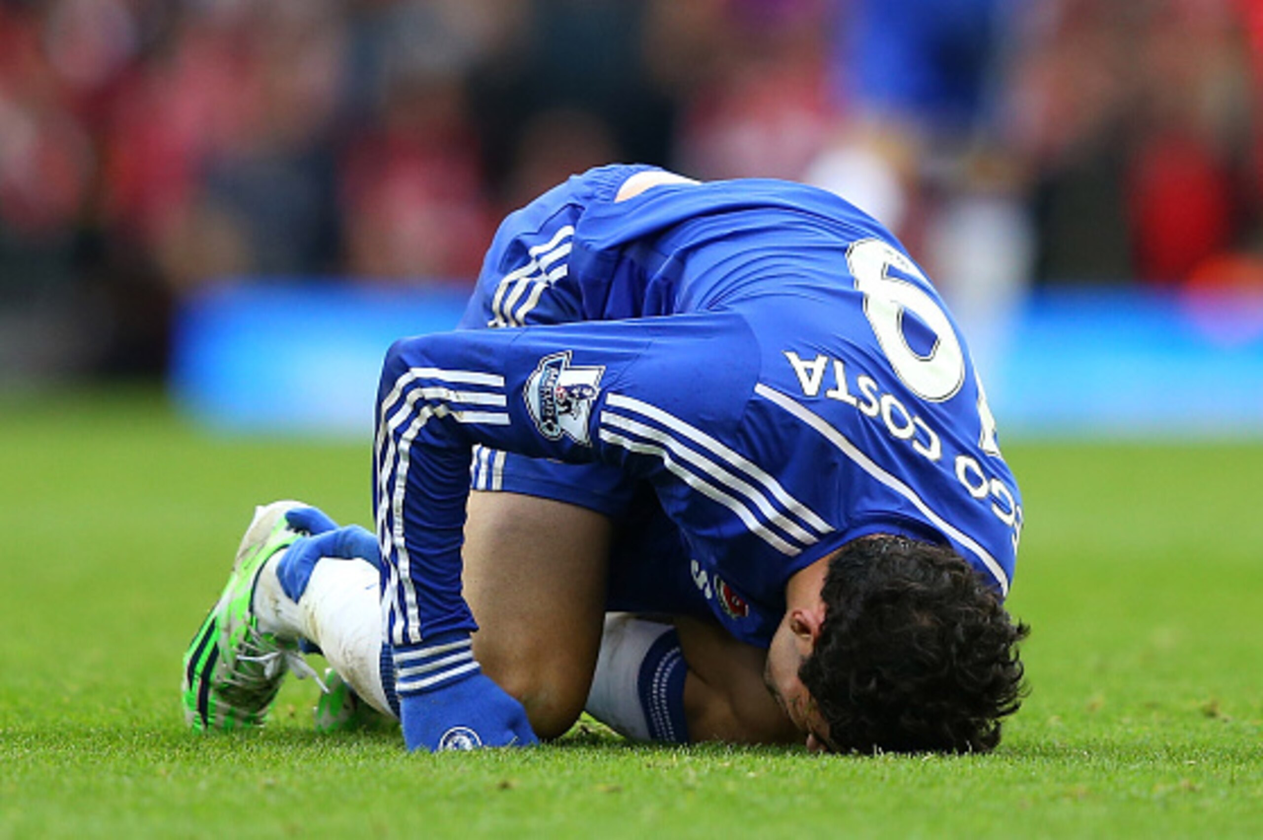 LIVERPOOL, ENGLAND - NOVEMBER 08:  Diego Costa of Chelsea lies injured during the Barclays Premier League match between Liverpool and Chelsea at Anfield on November 8, 2014 in Liverpool, England.  (Photo by Alex Livesey/Getty Images)
