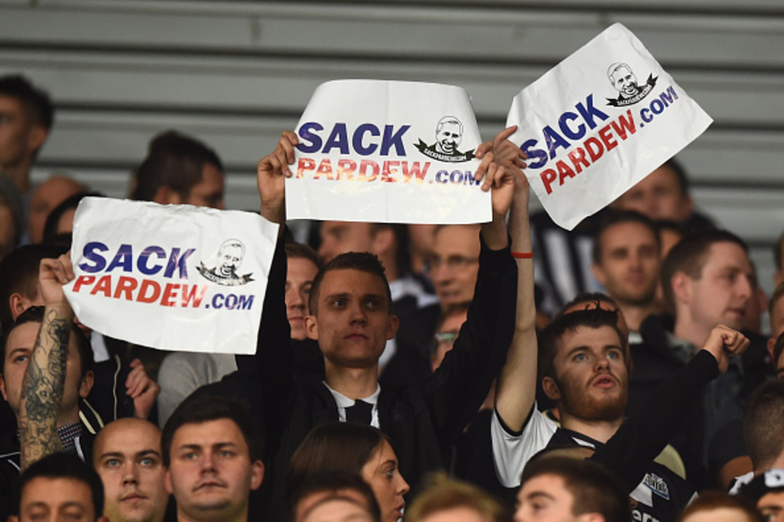 STOKE ON TRENT, ENGLAND - SEPTEMBER 29: Newcastle fans hold up signs calling for Alan Pardew, manager of Newcastle United, to be sacked as they watch the Barclays Premier League match between Stoke City and Newcastle United at Britannia Stadium on Septem STOKE ON TRENT, ENGLAND - SEPTEMBER 29: Newcastle fans hold up signs calling for Alan Pardew, manager of Newcastle United, to be sacked as they watch the Barclays Premier League match between Stoke City and Newcastle United at Britannia Stadium on Septem
