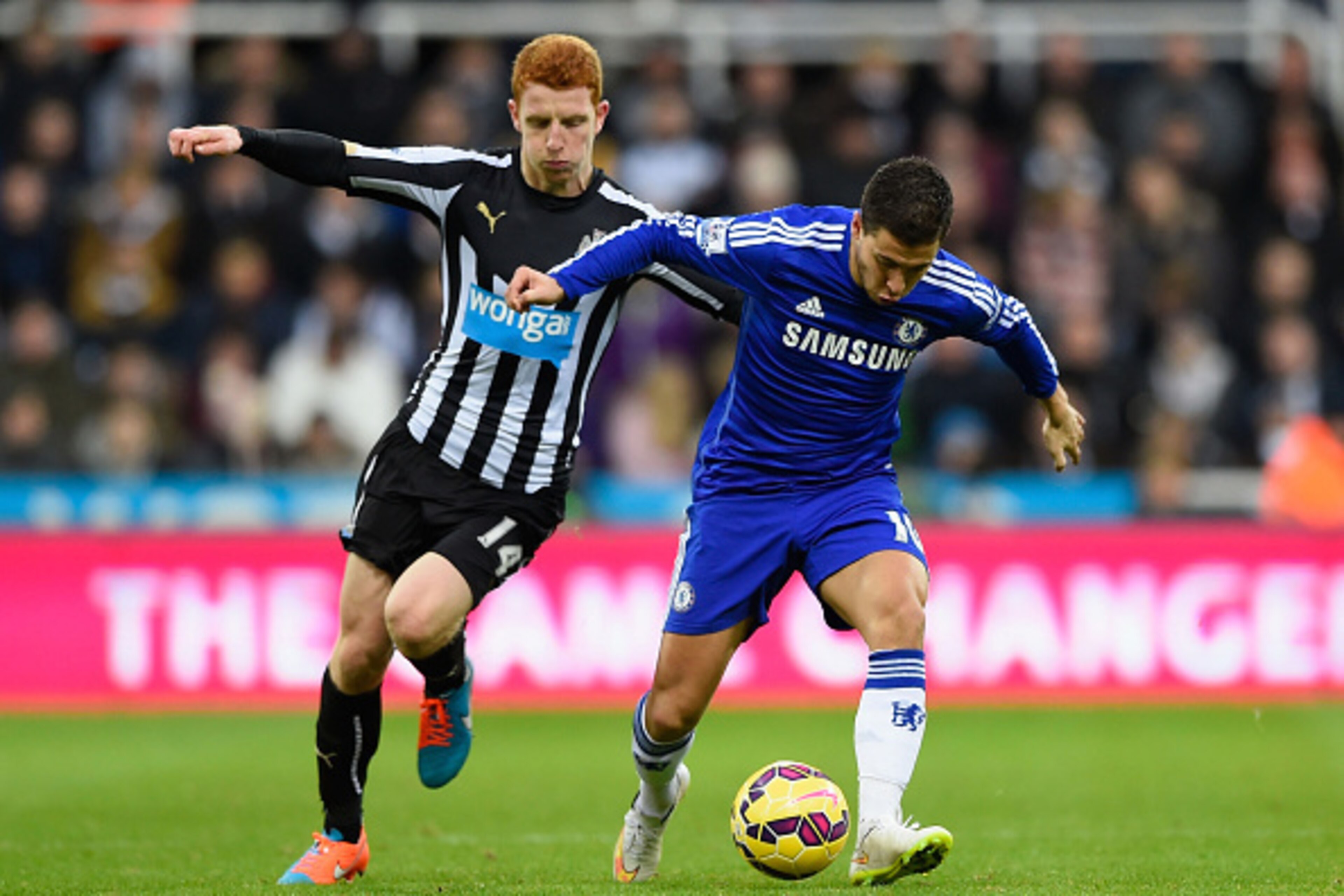 NEWCASTLE UPON TYNE, ENGLAND - DECEMBER 06:  Eden Hazard of Chelsea is cjhallenged by Jack Colback of Newcastle United during the Barclays Premier League match between Newcastle United and Chelsea at St James' Park on December 6, 2014 in Newcastle upon Ty